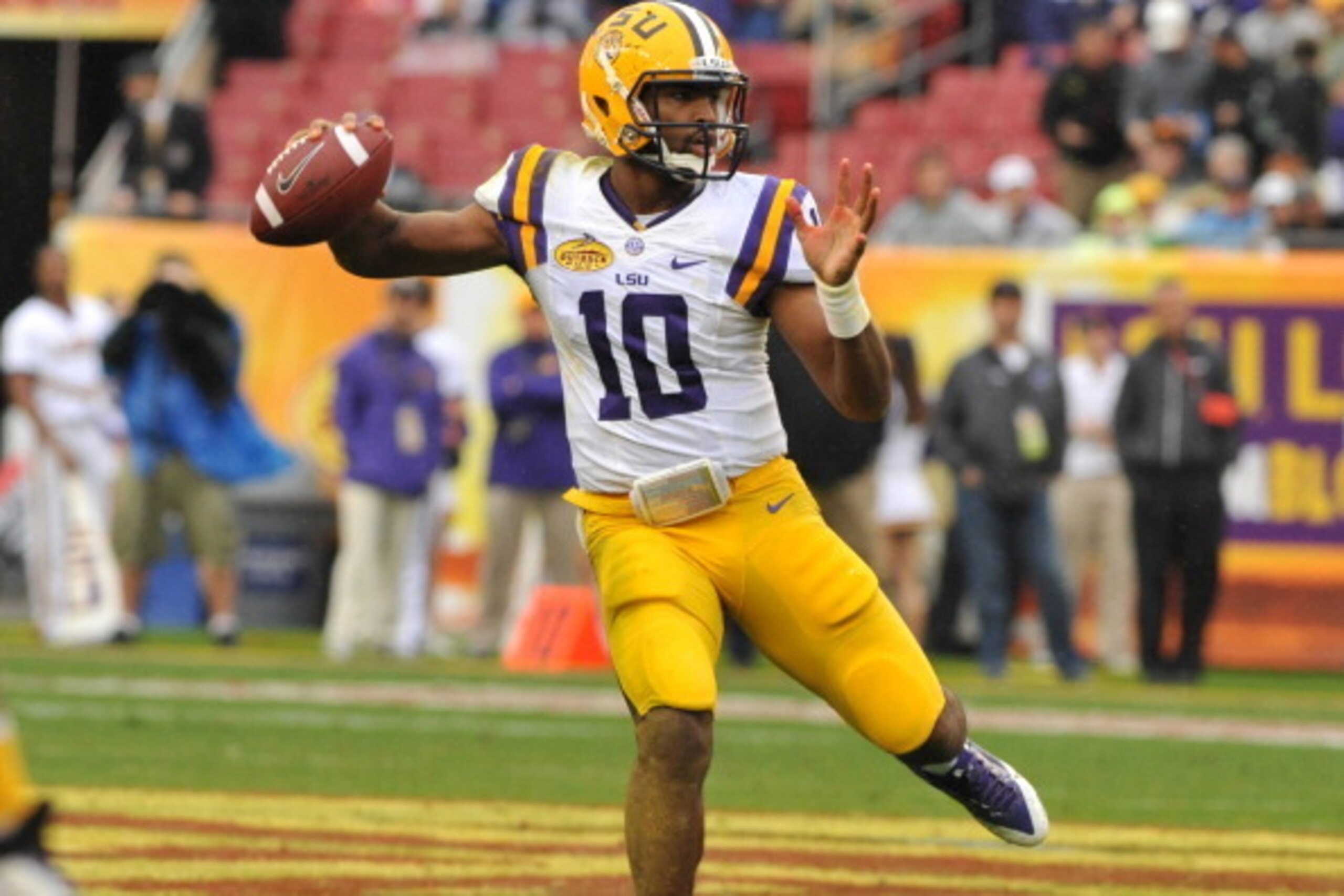 TAMPA, FL -  JANUARY 1:  Quarterback Anthony Jennings #10 of the LSU Tigers looks to pass against the Iowa Hawkeyes January 1, 2014  in the Outback Bowl at Raymond James Stadium in Tampa, Florida.  LSU won 21 - 14. (Photo by Al Messerschmidt/Getty Images)