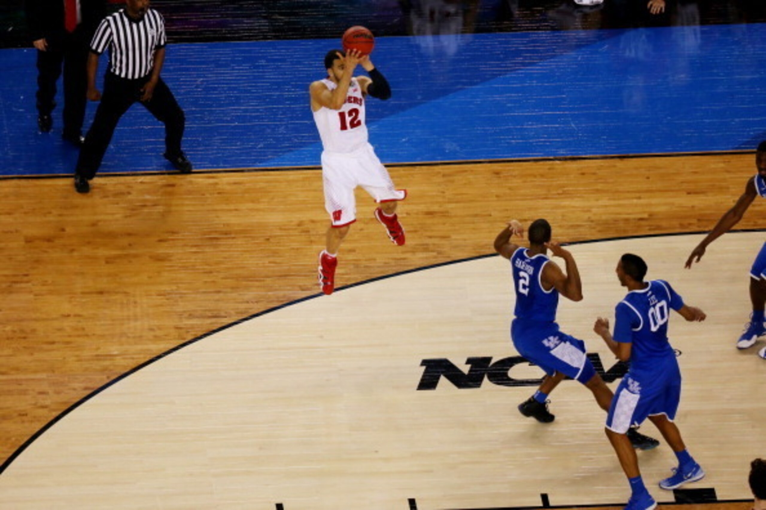 ARLINGTON, TX - APRIL 05: Traevon Jackson #12 of the Wisconsin Badgers misses a shot at the buzzer against the Kentucky Wildcats during the NCAA Men's Final Four Semifinal at AT&T Stadium on April 5, 2014 in Arlington, Texas. The Kentucky Wildcats defeate