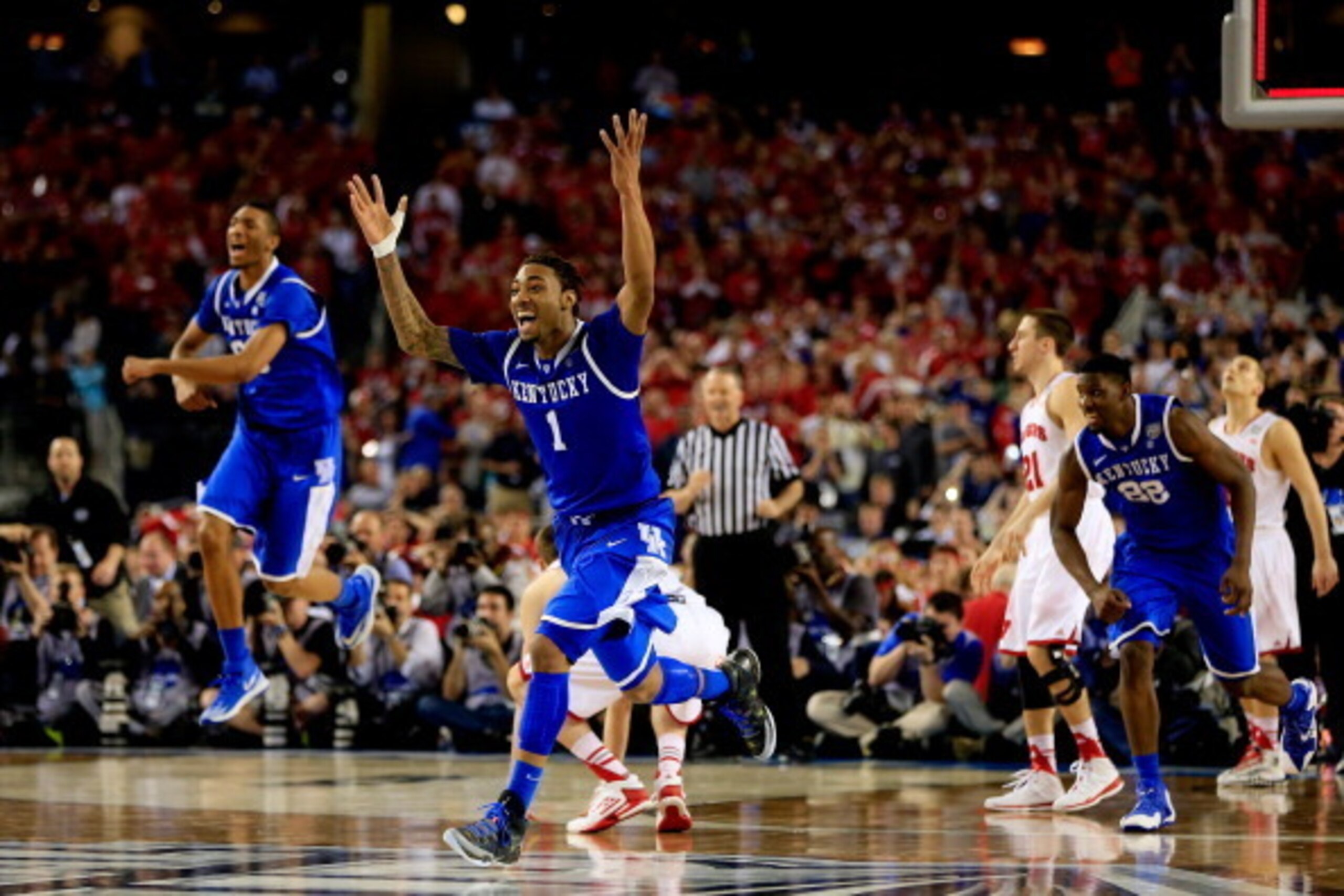 ARLINGTON, TX - APRIL 05: James Young #1 of the Kentucky Wildcats reacts after defeating the Wisconsin Badgers 74-73 in the NCAA Men's Final Four Semifinal at AT&T Stadium on April 5, 2014 in Arlington, Texas.  (Photo by Jamie Squire/Getty Images)