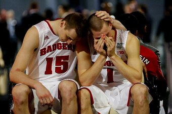 ARLINGTON, TX - APRIL 05: Sam Dekker #15 and Ben Brust #1 of the Wisconsin Badgers react after losing to the Kentucky Wildcats 74-73 in the NCAA Men's Final Four Semifinal at AT&T Stadium on April 5, 2014 in Arlington, Texas.  (Photo by Ronald Martinez/Ge