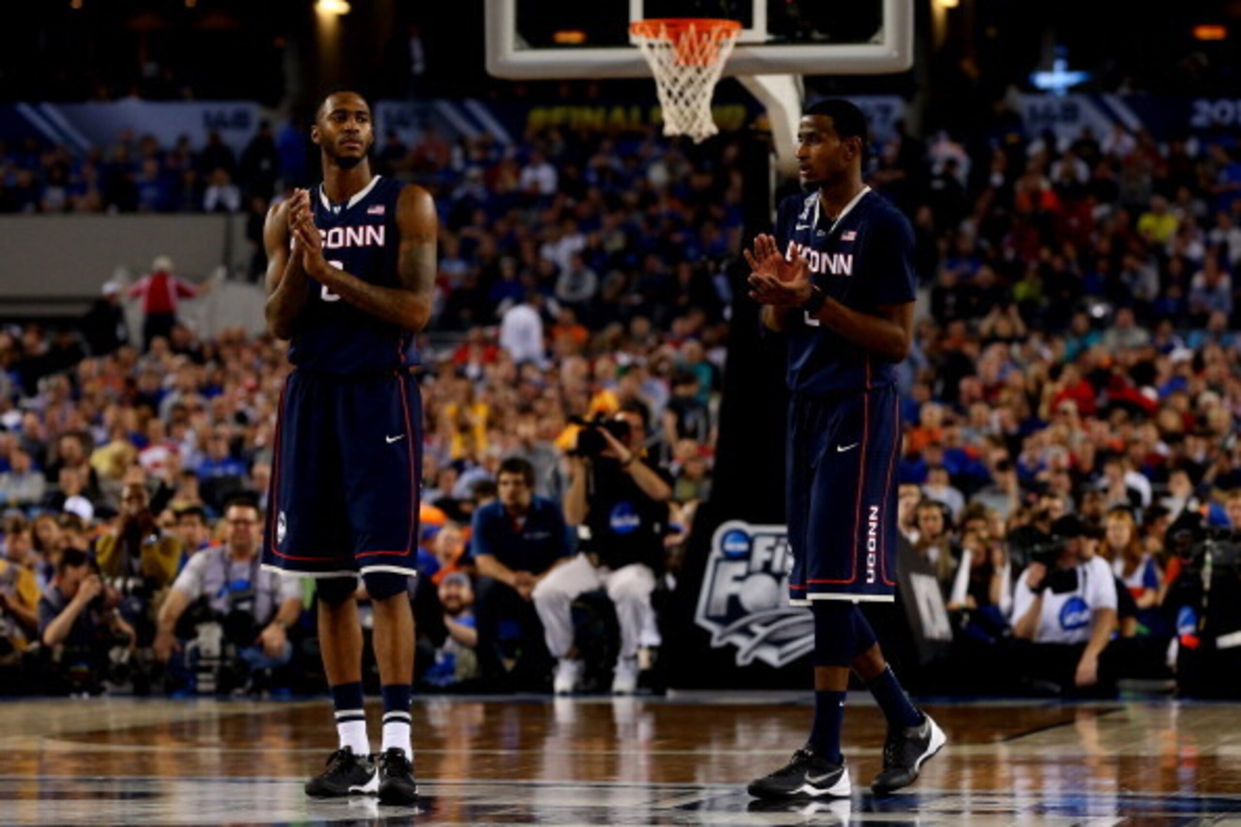ARLINGTON, TX - APRIL 05: Phillip Nolan #0 and DeAndre Daniels #2 of the Connecticut Huskies celebrate during the NCAA Men's Final Four Semifinal against the Florida Gators at AT&T Stadium on April 5, 2014 in Arlington, Texas.  (Photo by Ronald Martinez/G