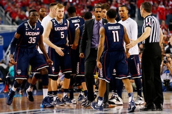 ARLINGTON, TX - APRIL 05: Head coach Kevin Ollie of the Connecticut Huskies reacts after calling a timeout during the NCAA Men's Final Four Semifinal against the Florida Gators at AT&T Stadium on April 5, 2014 in Arlington, Texas.  (Photo by Tom Penningto