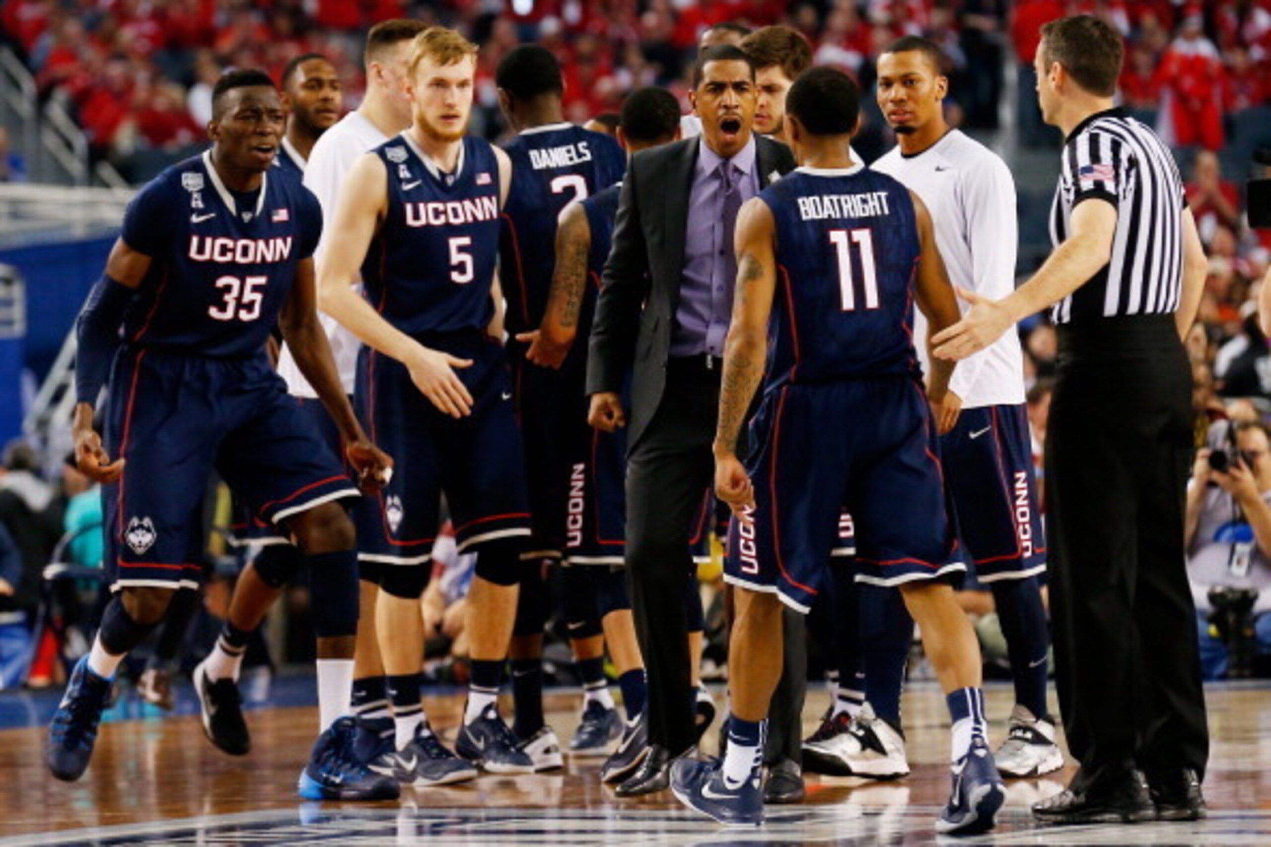ARLINGTON, TX - APRIL 05: Head coach Kevin Ollie of the Connecticut Huskies reacts after calling a timeout during the NCAA Men's Final Four Semifinal against the Florida Gators at AT&T Stadium on April 5, 2014 in Arlington, Texas.  (Photo by Tom Penningto