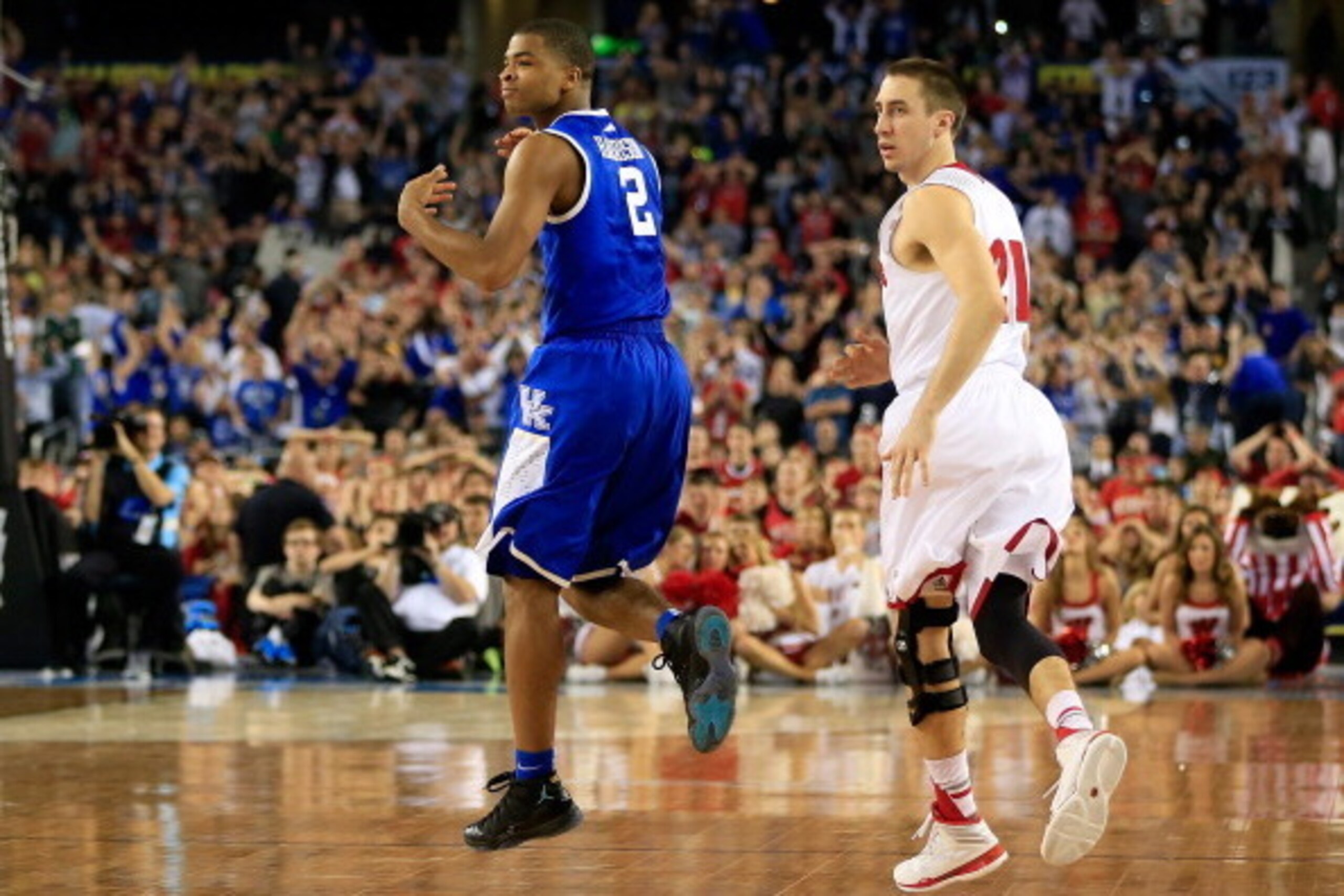 ARLINGTON, TX - APRIL 05:  Aaron Harrison #2 of the Kentucky Wildcats reacts after hitting the game winning shot to defeat the Wisconsin Badgers 74-73 in the NCAA Men's Final Four Semifinal at AT&T Stadium on April 5, 2014 in Arlington, Texas.  (Photo by 