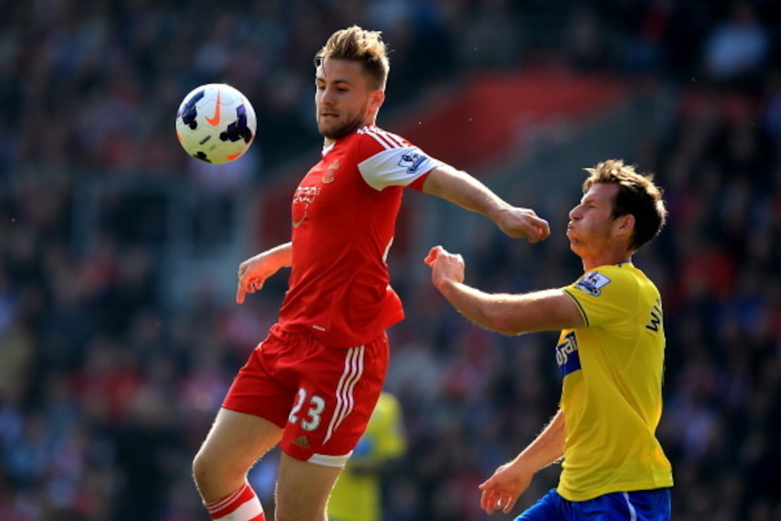 SOUTHAMPTON, ENGLAND - MARCH 29:  Luke Shaw of Southampton controls the ball under pressure from Michael Williamson of Newcastle United during the Barclays Premier League match between Southampton and Newcastle United at St Mary's Stadium on March 29, 201