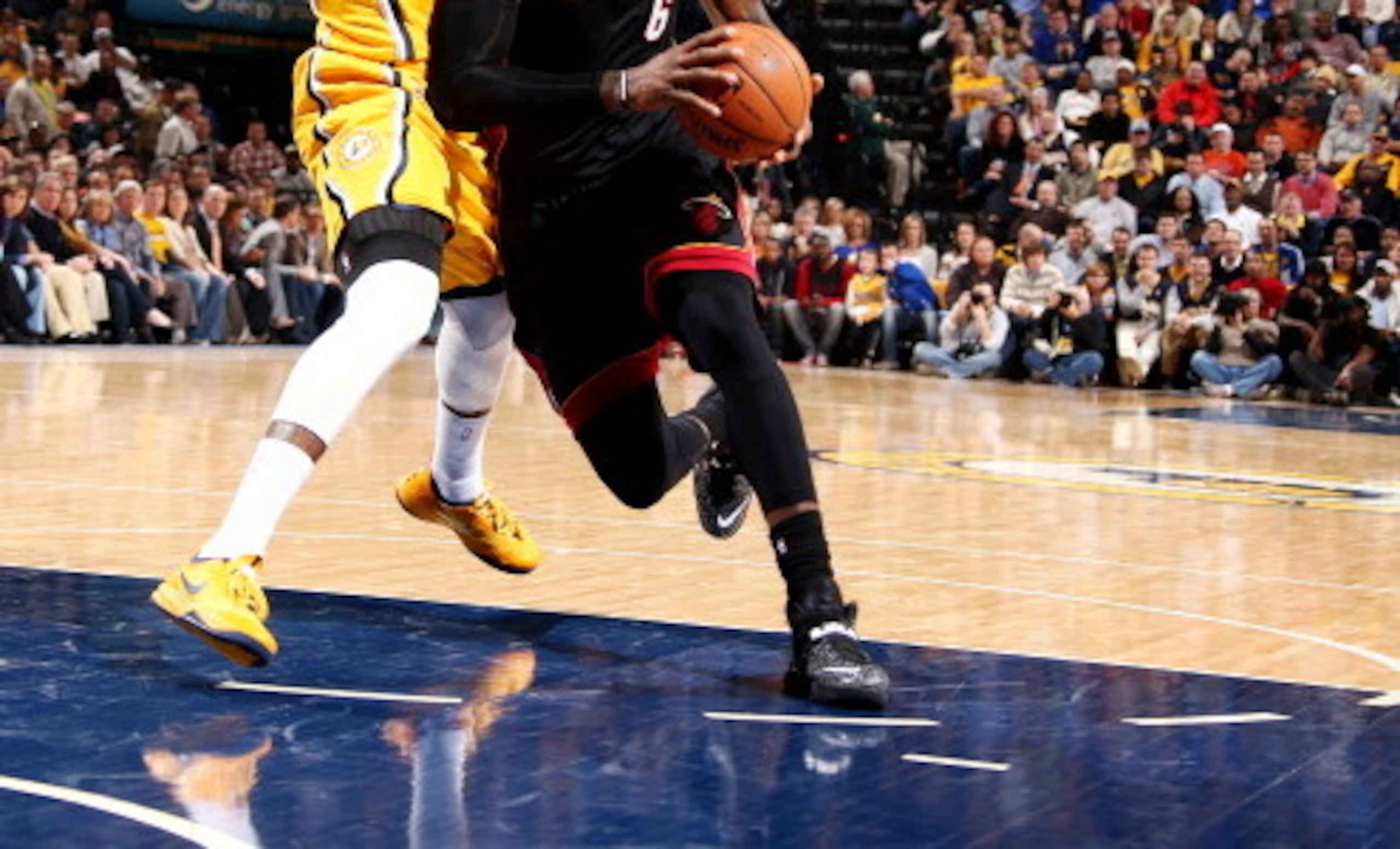INDIANAPOLIS, IN - MARCH 26: LeBron James #6 of the Miami Heat drives against Paul George #24 of the Indiana Pacers during a game on March 26, 2014 at Bankers Life Fieldhouse in Indianapolis, IN.  NOTE TO USER: User expressly acknowledges and agrees that,