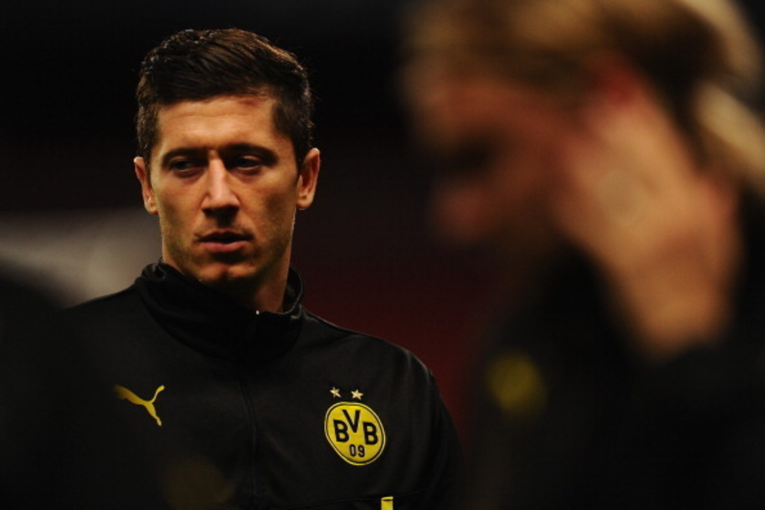 LONDON, ENGLAND - OCTOBER 21:  Robert Lewandowski looks on during a Borussia Dortmund training session ahead of the UEFA Champions League Group F match against Arsenal at Emirates Stadium on October 21, 2013 in London, England.  (Photo by Mike Hewitt/Gett