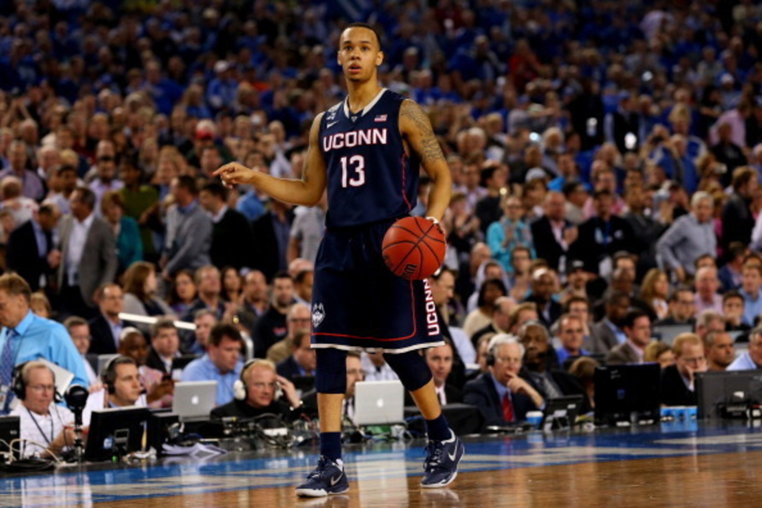 ARLINGTON, TX - APRIL 05: Shabazz Napier #13 of the Connecticut Huskies brings the ball up the floor against the Florida Gators during the NCAA Men's Final Four Semifinal at AT&T Stadium on April 5, 2014 in Arlington, Texas.  (Photo by Ronald Martinez/Get