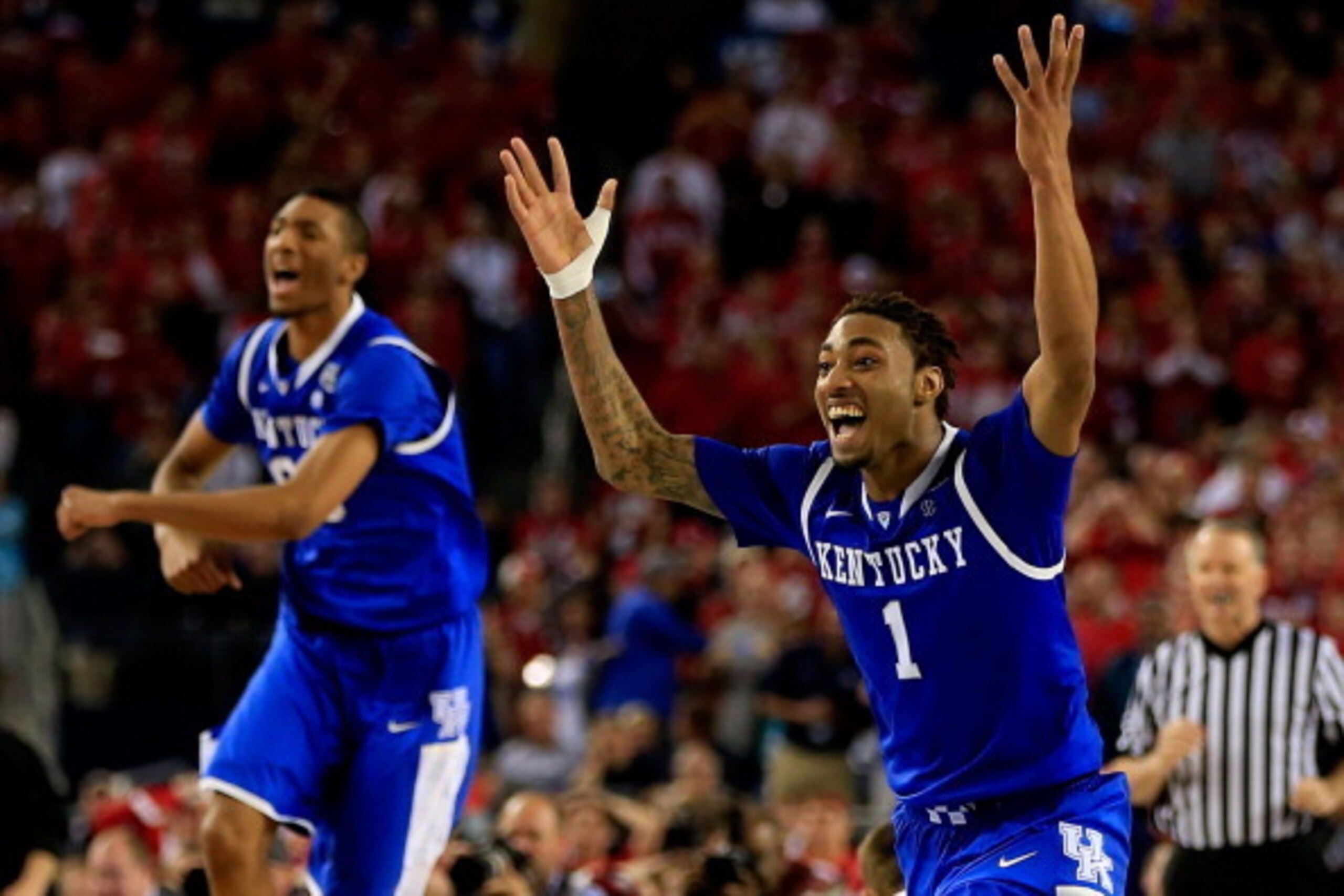 ARLINGTON, TX - APRIL 05: James Young #1 of the Kentucky Wildcats reacts after defeating the Wisconsin Badgers 74-73 in the NCAA Men's Final Four Semifinal at AT&T Stadium on April 5, 2014 in Arlington, Texas.  (Photo by Jamie Squire/Getty Images)