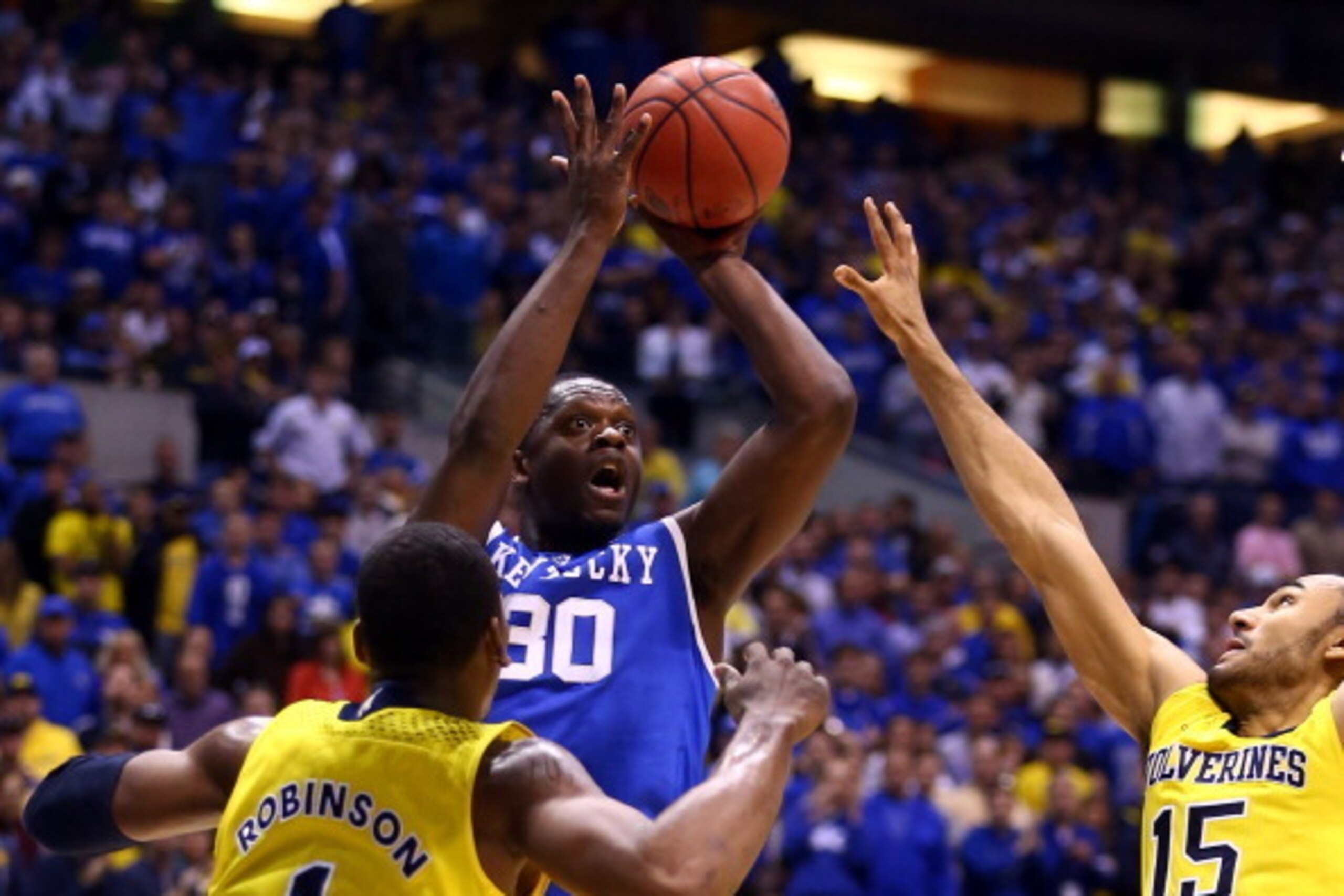 INDIANAPOLIS, IN - MARCH 30:  Julius Randle #30 of the Kentucky Wildcats shoots the ball aginst Jon Horford #15 of the Michigan Wolverines in the first half during the midwest regional final of the 2014 NCAA Men's Basketball Tournament at Lucas Oil Stadiu
