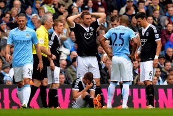 MANCHESTER, ENGLAND - APRIL 05:  Jay Rodriguez of Southampton goes down injured during the Barclays Premier League match between Manchester City and Southampton at Etihad Stadium on April 5, 2014 in Manchester, England.  (Photo by Shaun Botterill/Getty Im