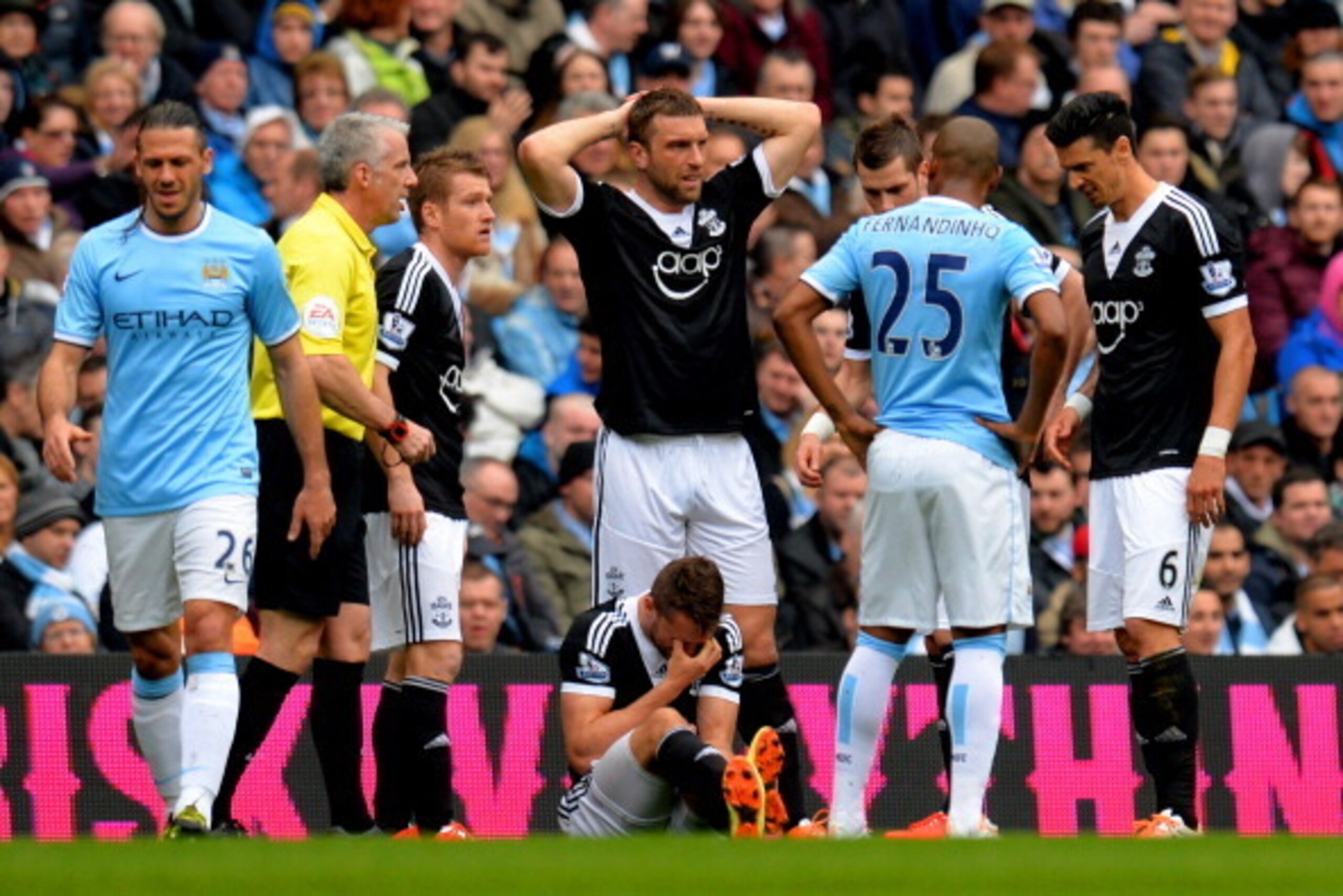 MANCHESTER, ENGLAND - APRIL 05:  Jay Rodriguez of Southampton goes down injured during the Barclays Premier League match between Manchester City and Southampton at Etihad Stadium on April 5, 2014 in Manchester, England.  (Photo by Shaun Botterill/Getty Im