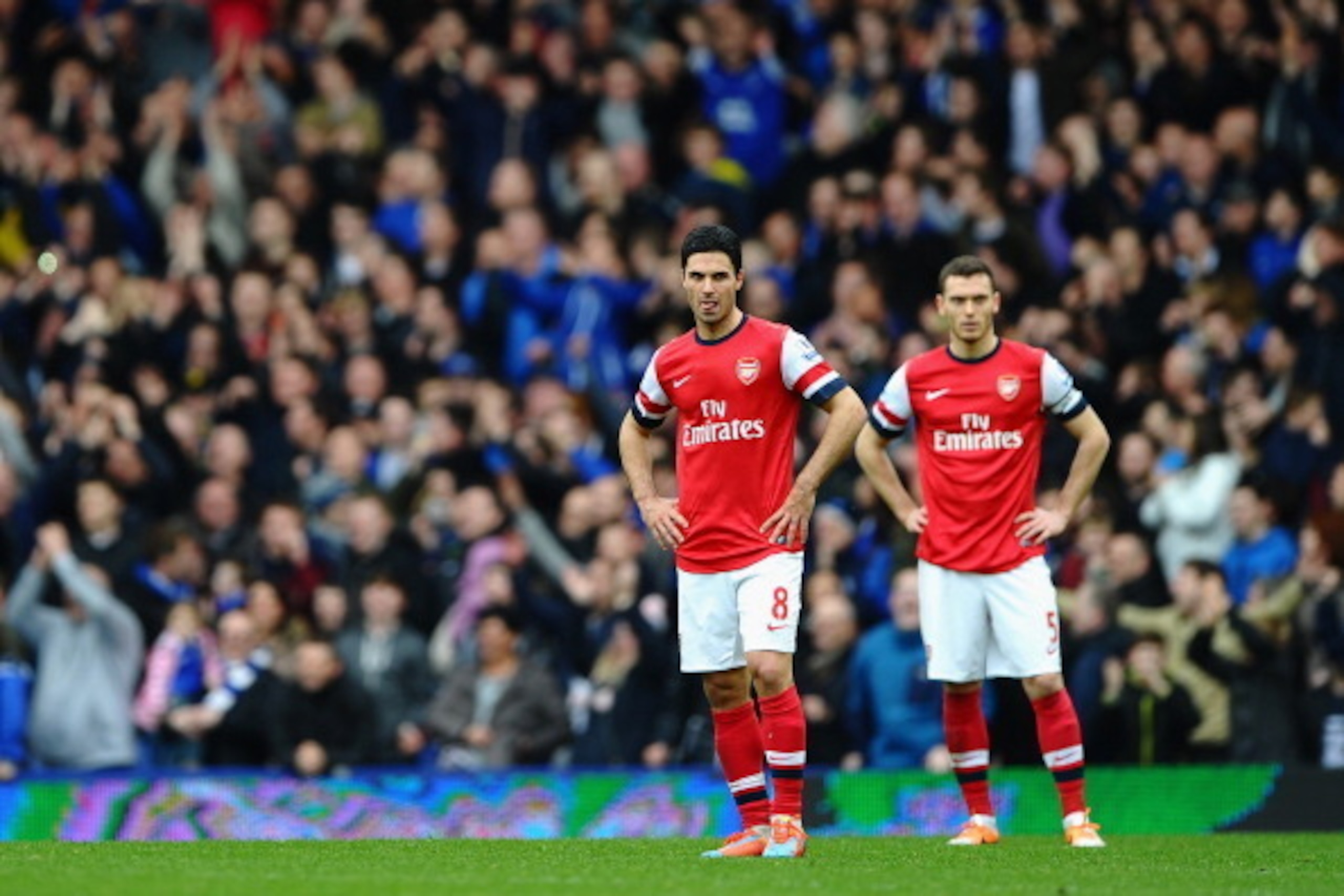 LIVERPOOL, ENGLAND - APRIL 06:  Thomas Vermaelen, Mikel Arteta (L) and Wojciech Szczesny (R)  of Arsenal look on after conceding a third goal during the Barclays Premier League match between Everton and Arsenal at Goodison Park on April 6, 2014 in Liverpo