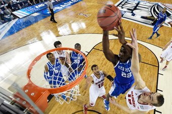 ARLINGTON, TX - APRIL 05: Alex Poythress #22 of the Kentucky Wildcats goes up for a shot as Sam Dekker #15 of the Wisconsin Badgers defends during the NCAA Men's Final Four Semifinal at AT&T Stadium on April 5, 2014 in Arlington, Texas. (Photo by Chris St ARLINGTON, TX - APRIL 05: Alex Poythress #22 of the Kentucky Wildcats goes up for a shot as Sam Dekker #15 of the Wisconsin Badgers defends during the NCAA Men's Final Four Semifinal at AT&T Stadium on April 5, 2014 in Arlington, Texas. (Photo by Chris St