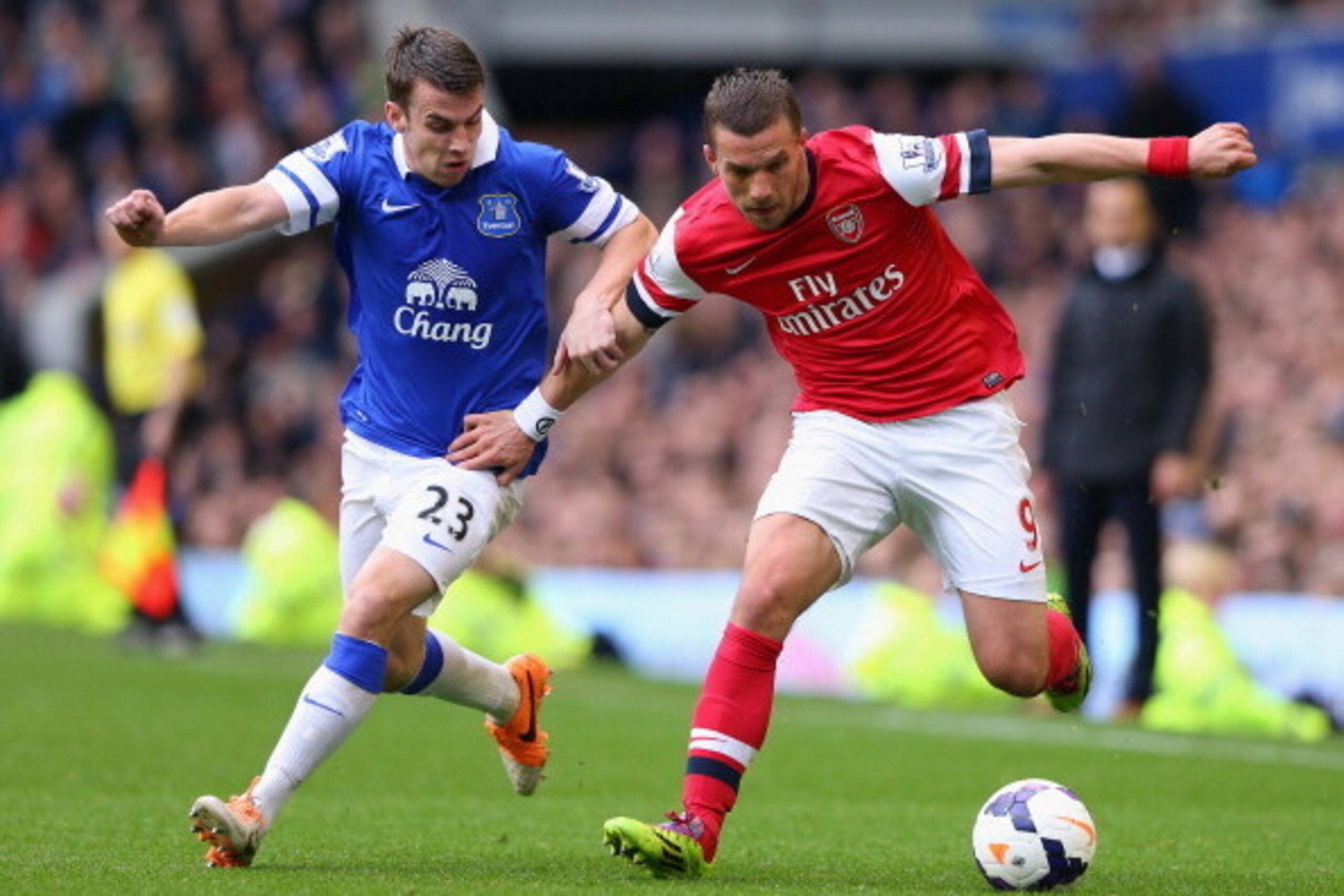 LIVERPOOL, ENGLAND - APRIL 06:  Seamus Coleman of Everton competes with Lukas Podolski of Arsenal during the Barclays Premier League match between Everton and Arsenal at Goodison Park on April 6, 2014 in Liverpool, England.  (Photo by Alex Livesey/Getty I