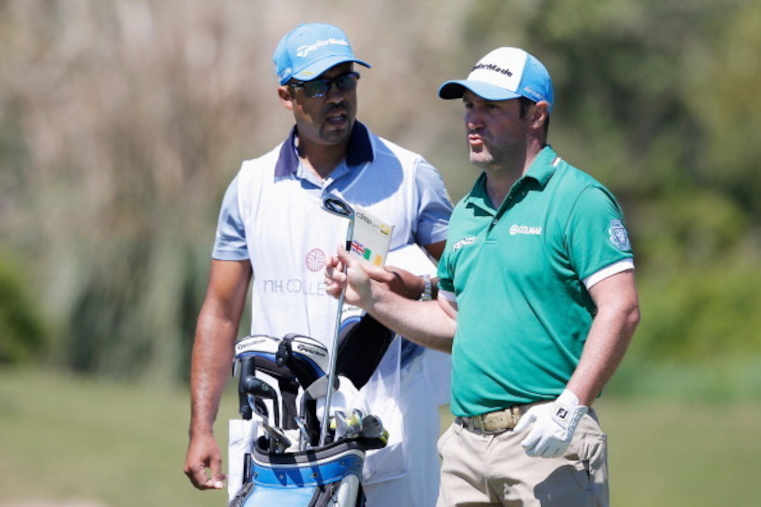 CADIZ, SPAIN - APRIL 06:  Marco Crespi of Italy selects a club before he hits his second shot on the 10th hole during the Final Round of the NH Collection Open held at La Reserva de Sotogrande Club de Golf on April 6, 2014 in Cadiz, Spain.  (Photo by Dean