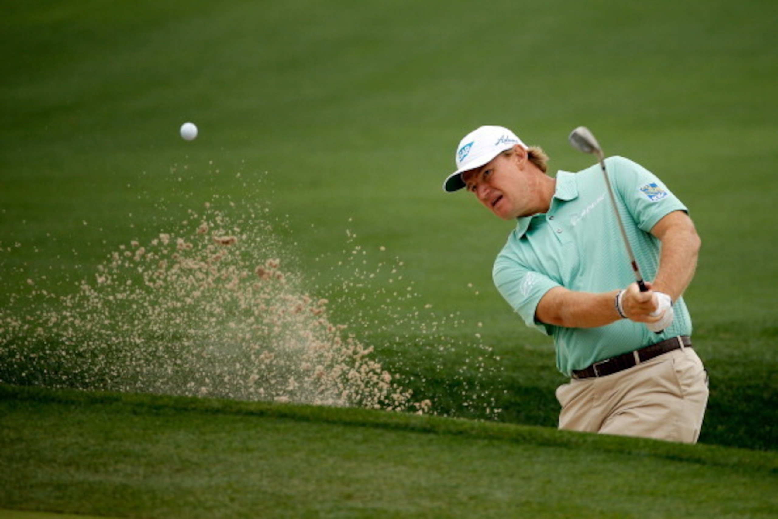 HUMBLE, TX - APRIL 03:  Ernie Els of South Africa hits a shot out of the bunker on the eighth hole during round one of the Shell Houston Open at the Golf Club of Houston on April 3, 2014 in Humble, Texas.  (Photo by Scott Halleran/Getty Images)