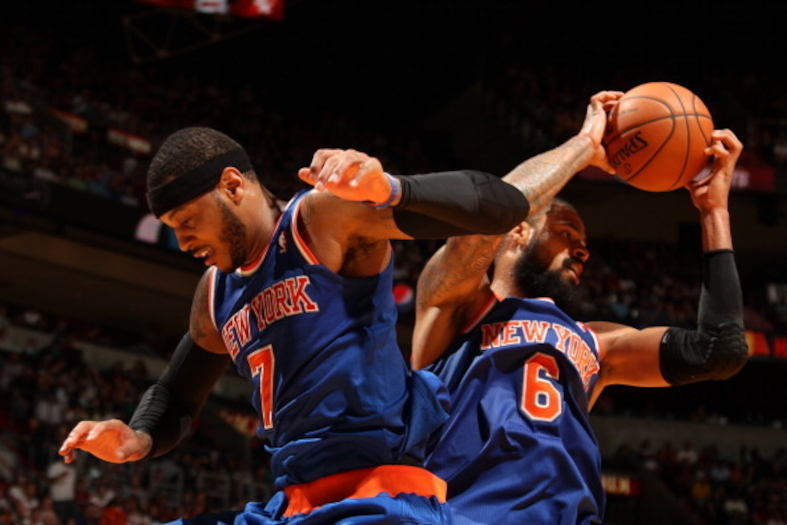 MIAMI, FL - April 6: Carmelo Anthony #7 and Tyson Chandler #6 of the New York Knicks rebound the ball during the game against the Miami Heat at the American Airlines Arena in Miami, Florida on April 6, 2014. NOTE TO USER: User expressly acknowledges and a