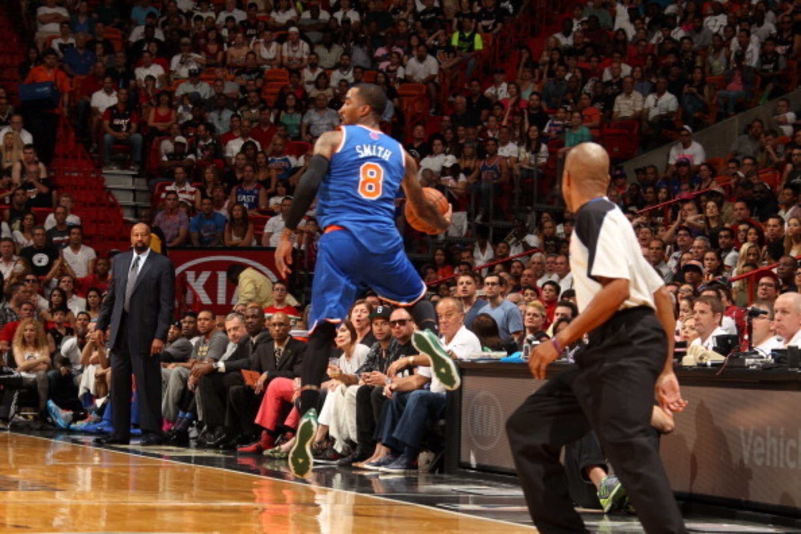 MIAMI, FL - April 6: J.R. Smith #8 of the New York Knicks saves the ball during the game against the Miami Heat at the American Airlines Arena in Miami, Florida on April 6, 2014. NOTE TO USER: User expressly acknowledges and agrees that, by downloading an