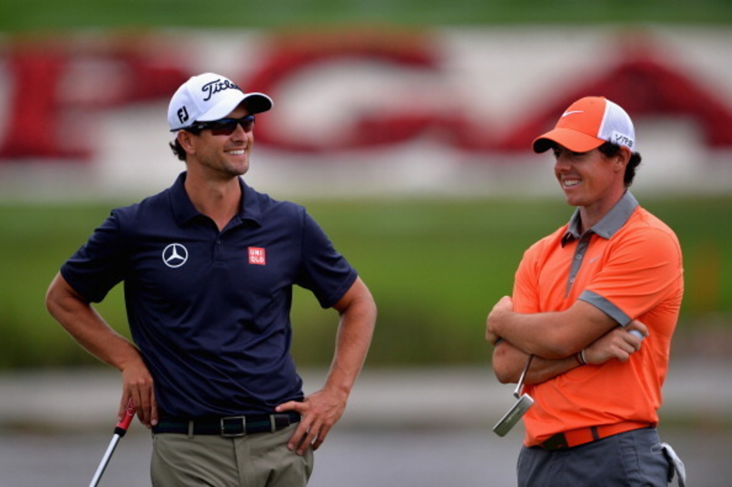 PALM BEACH GARDENS, FL - FEBRUARY 27:  Rory McIlroy of Northern Ireland (R) and Adam Scott of Australia talk to one another during the first round of The Honda Classic at PGA National Resort and Spa on February 27, 2014 in Palm Beach Gardens, Florida.  (P