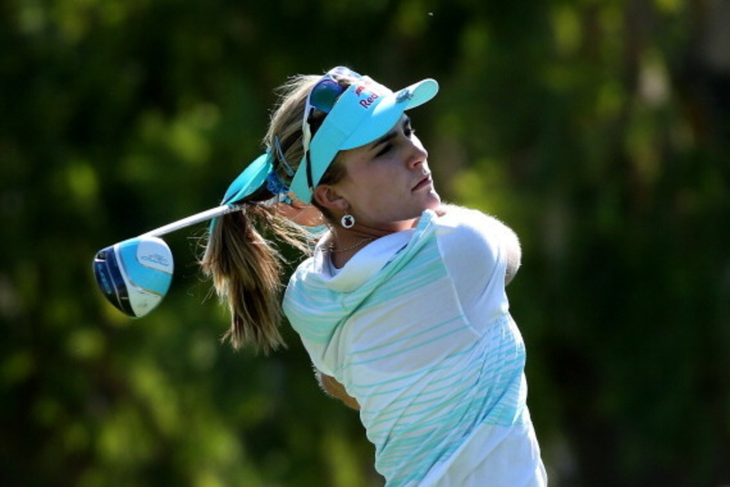 RANCHO MIRAGE, CA - APRIL 06:  Lexi Thompson hits her tee shot on the seventh hole during the final round of the Kraft Nabisco Championship at Mission Hills Country Club on April 6, 2014 in Rancho Mirage, California.  (Photo by Stephen Dunn/Getty Images)