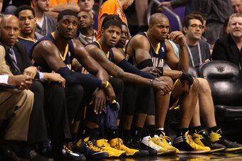 PHOENIX, AZ - JANUARY 22:  (R-L) David West #21, Lance Stephenson #1, Paul George #24 and Roy Hibbert #55 of the Indiana Pacers react on the bench during the second half of the NBA game against the Phoenix Suns at US Airways Center on January 22, 2014 in