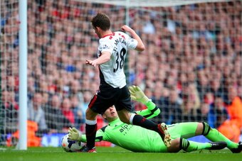LONDON, ENGLAND - APRIL 06:  Jon Flanagan of Liverpool is brought down by goalkeeper Adrian of West Ham to earn a penalty during the Barclays Premier League match between West Ham United and Liverpool at Boleyn Ground on April 6, 2014 in London, England. 