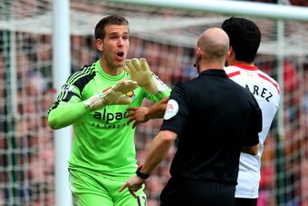 LONDON, ENGLAND - APRIL 06:  Goalkeeper Adrian of West Ham remonstrates with referee Anthony Taylor after he concedes a penalty for bringing down Jon Flanagan of Liverpool during the Barclays Premier League match between West Ham United and Liverpool at B