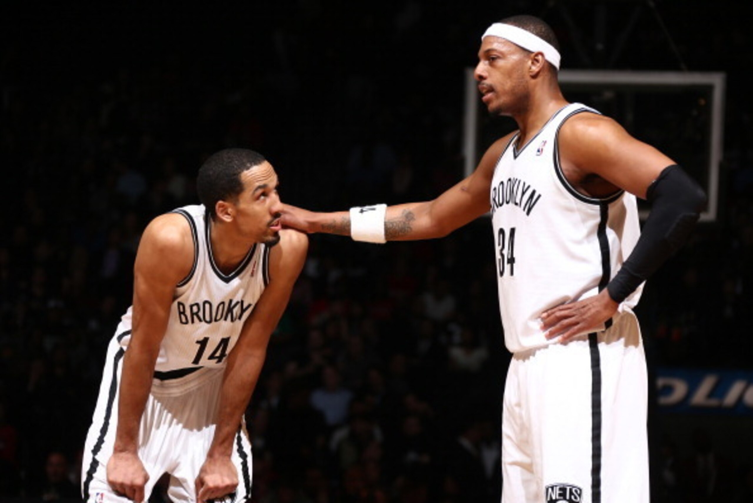 BROOKLYN, NY - MARCH 3: Paul Pierce #34 of the Brooklyn Nets speaks with Shaun Livingston #14 of the Brooklyn Nets during a game at the Barclays Center on March 3, 2014 in the Brooklyn borough of New York City.  NOTE TO USER: User expressly acknowledges a