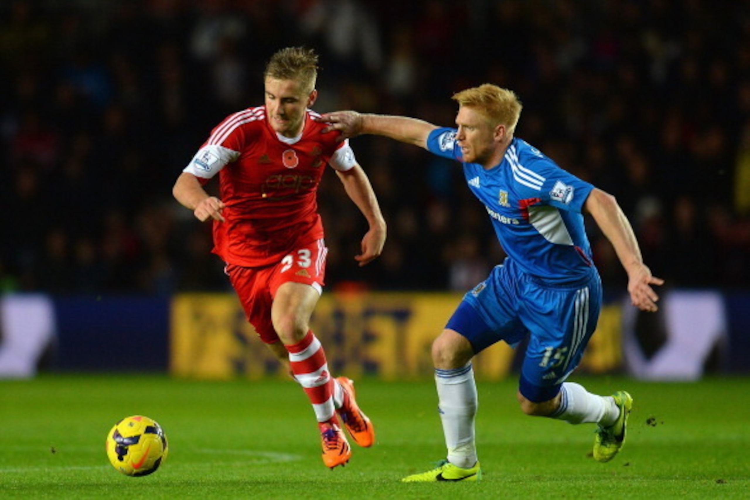 SOUTHAMPTON, ENGLAND - NOVEMBER 09:  Luke Shaw of Southampton is challenged by Paul McShane of Hull City during the Barclays Premier League match between Southampton and Hull City at St Mary's Stadium on November 9, 2013 in Southampton, England.  (Photo b