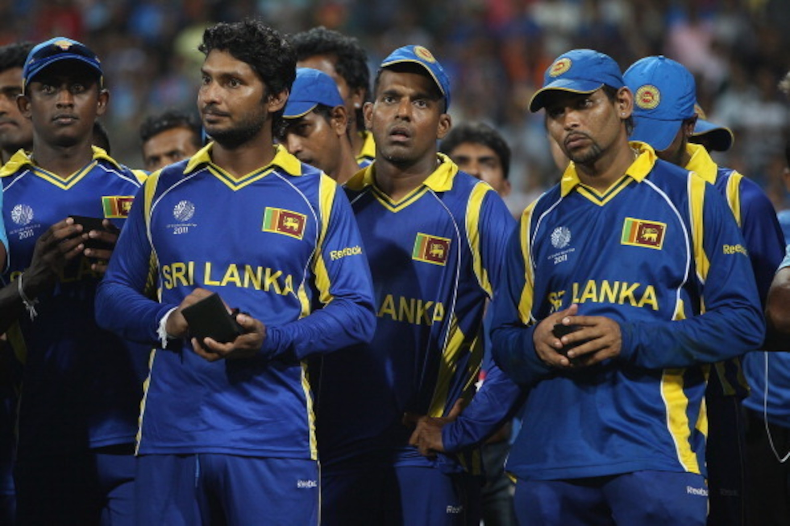 MUMBAI, INDIA - APRIL 02:  Kumar Sangakkara (L) captain of Sri Lanka looks on dejectedly alongside Tillakaratne Dilshan (R) at the trophy presentation after their six wicket defeat during the 2011 ICC World Cup Final between India and Sri Lanka at Wankhed