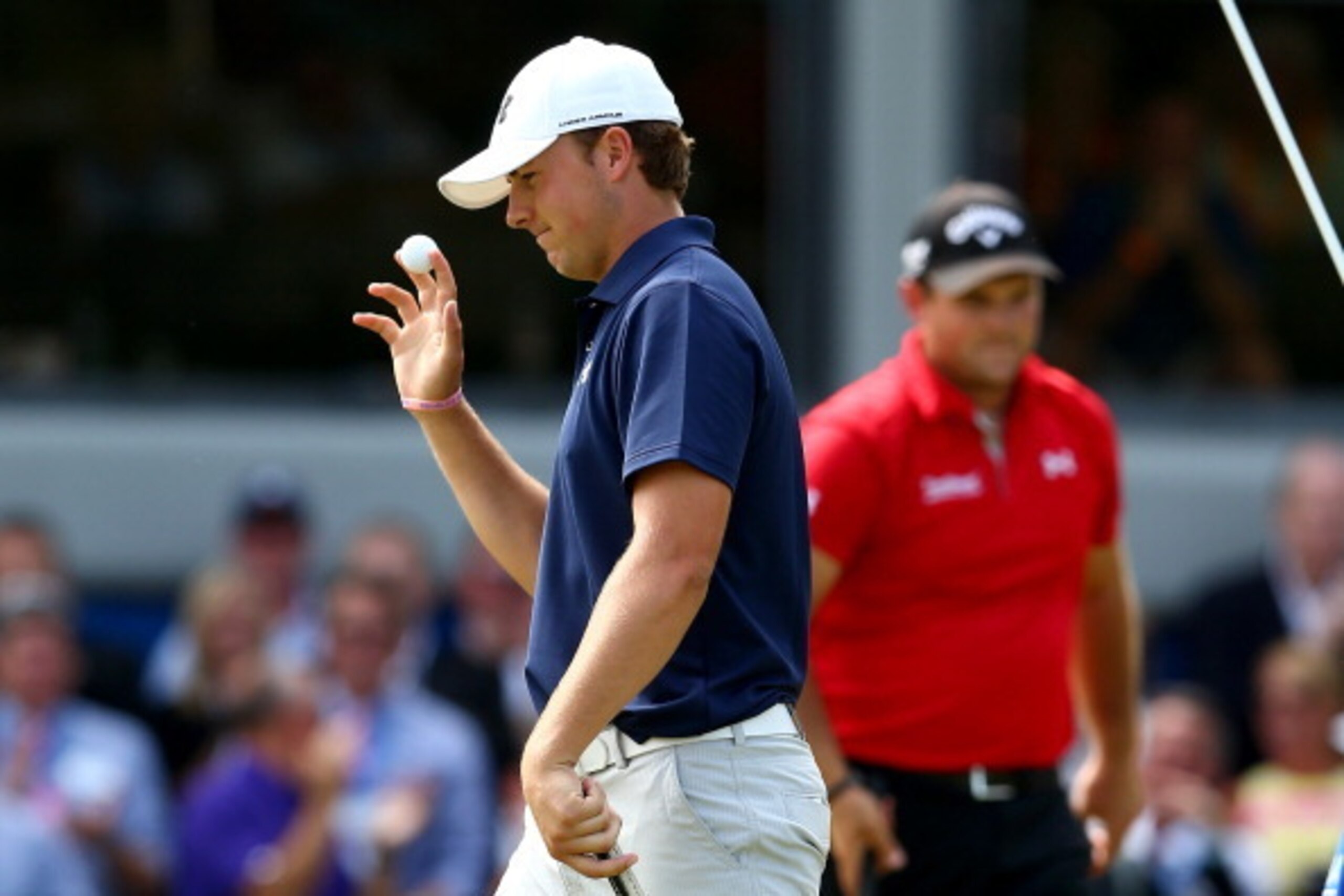 GREENSBORO, NC - AUGUST 18: (L-R) Jordan Spieth waves to the crowd as Patrick Reed watches on during their playoff on the 18th hole in the final round of the Wyndham Championship at Sedgefield Country Club on August 18, 2013 in Greensboro, North Carolina GREENSBORO, NC - AUGUST 18: (L-R) Jordan Spieth waves to the crowd as Patrick Reed watches on during their playoff on the 18th hole in the final round of the Wyndham Championship at Sedgefield Country Club on August 18, 2013 in Greensboro, North Carolina