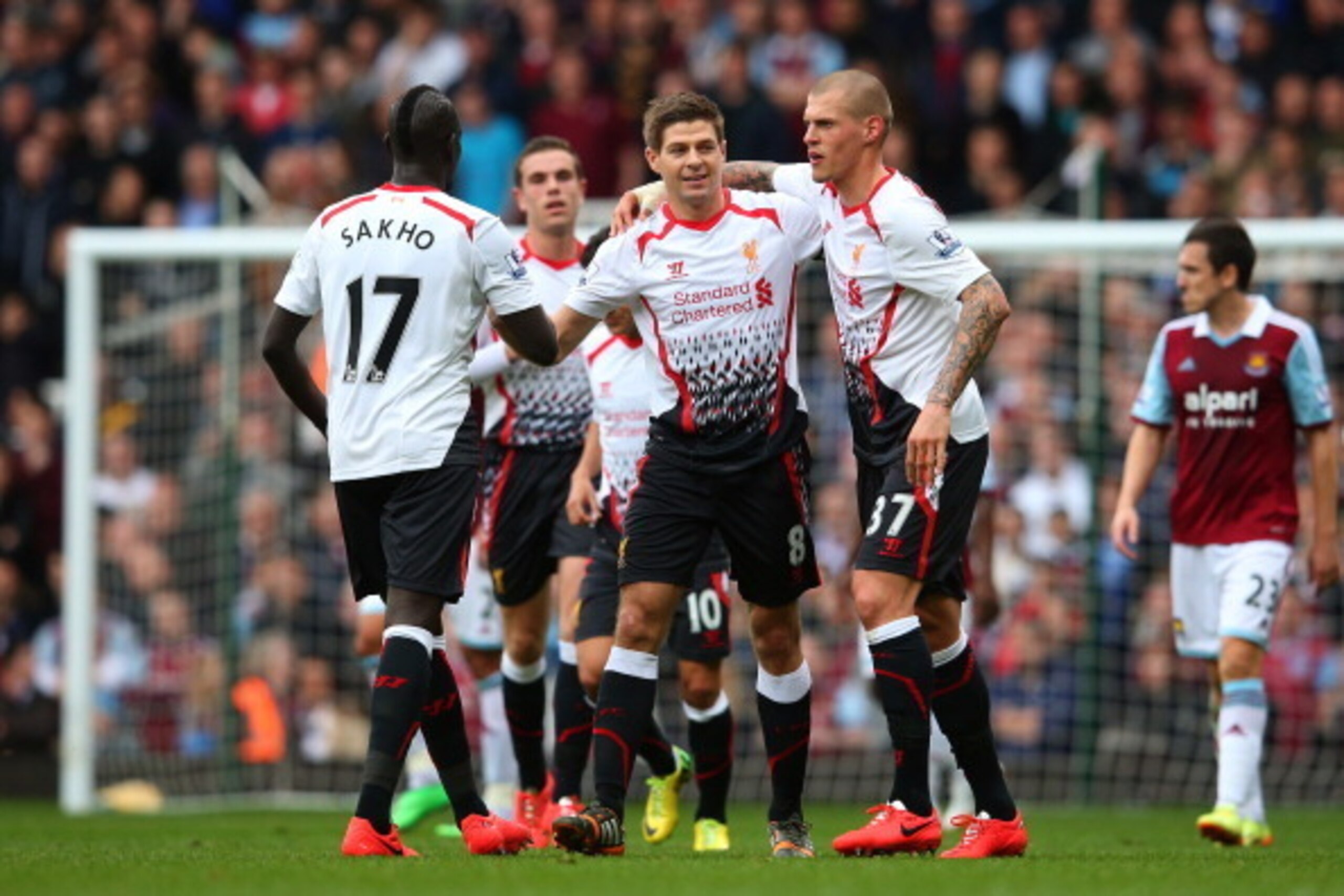 LONDON, ENGLAND - APRIL 06:  (L-R) Mamadou Sakho, Steven Gerrard and Martin Skrtel of Liverpool celebrate during the Barclays Premier League match between West Ham United and Liverpool at Boleyn Ground on April 6, 2014 in London, England.  (Photo by Julia