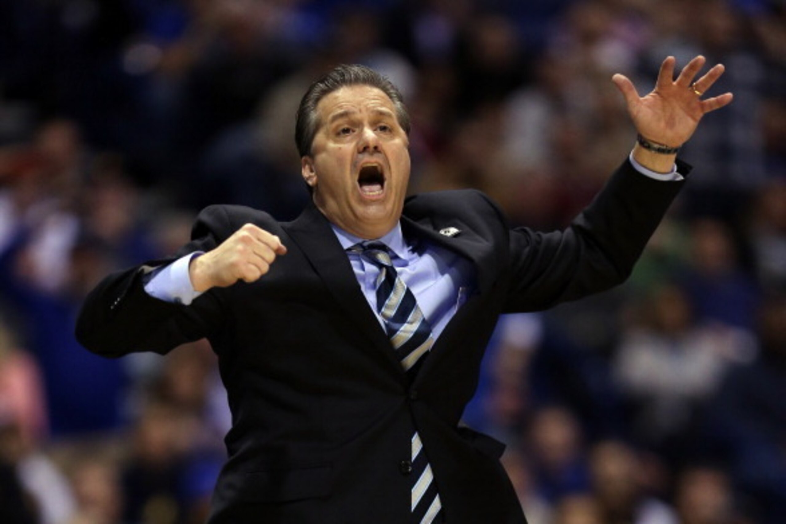 INDIANAPOLIS, IN - MARCH 30:  Head coach John Calipari of the Kentucky Wildcats shouts to his players against the Michigan Wolverines during the midwest regional final of the 2014 NCAA Men's Basketball Tournament at Lucas Oil Stadium on March 30, 2014 in 