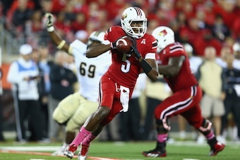 LOUISVILLE, KY - OCTOBER 18:  Teddy Bridgewater #5 of the Louisville Cardinals runs with the ball during the game against the Central Florida Knights at Papa John's Cardinal Stadium on October 18, 2013 in Louisville, Kentucky.  (Photo by Andy Lyons/Getty 