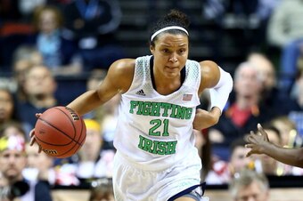 NASHVILLE, TN - APRIL 06:  Kayla McBride #21 of the Notre Dame Fighting Irish handles the ball in the second half against the Maryland Terrapins during the NCAA Women's Final Four semifinal at Bridgestone Arena on April 6, 2014 in Nashville, Tennessee.  (