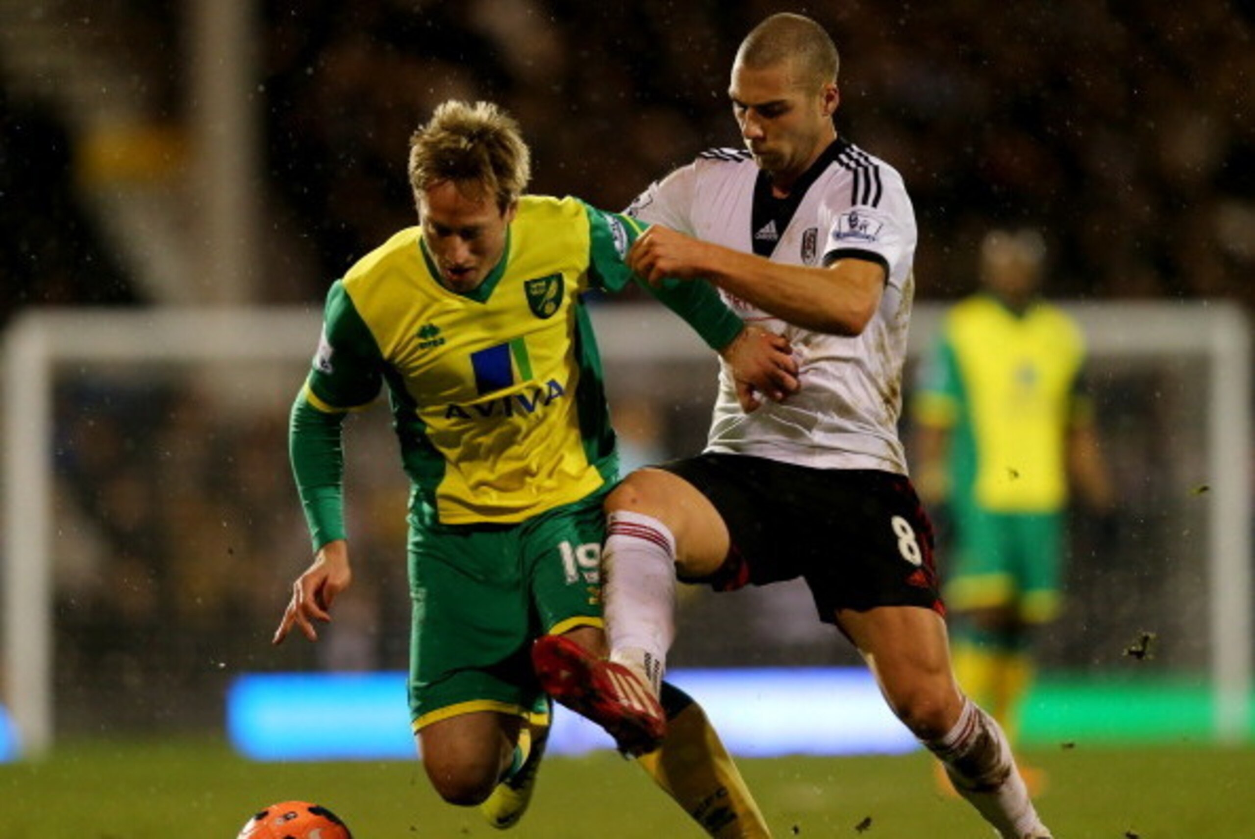 LONDON, ENGLAND - JANUARY 14:  Luciano Becchio of Norwich City battles with Pajtim Kasami of Fulham during the FA Cup with Budweiser Third round replay match between Fulham and Norwich City at Craven Cottage on January 14, 2014 in London, England.  (Photo