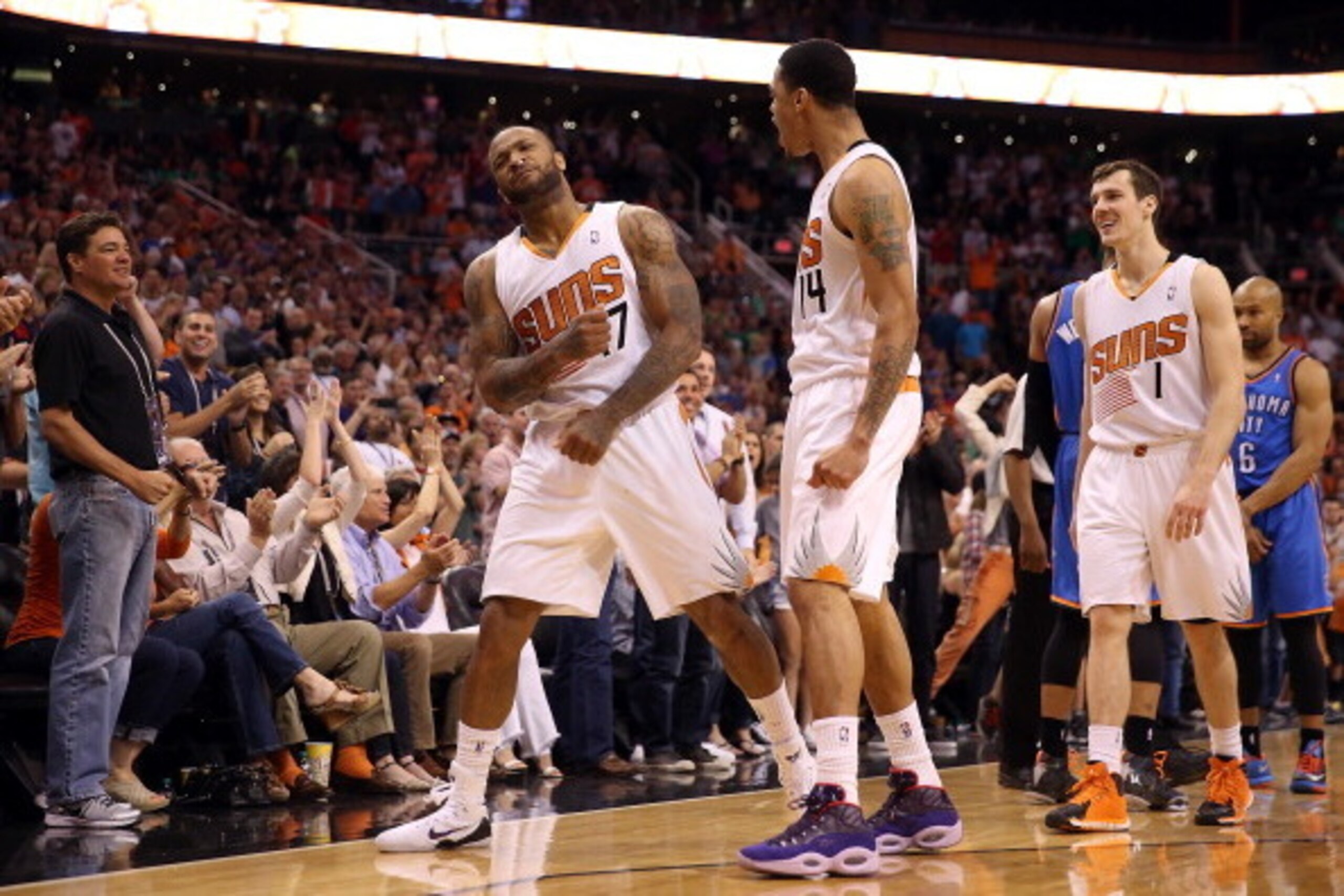 PHOENIX, AZ - APRIL 06:  P.J. Tucker #17 of the Phoenix Suns celebrates with Gerald Green #14 and Goran Dragic #1 and Tucker after stole the ball and drew a foul from Derek Fisher #6 of the Oklahoma City Thunder during the second half of the NBA game at U