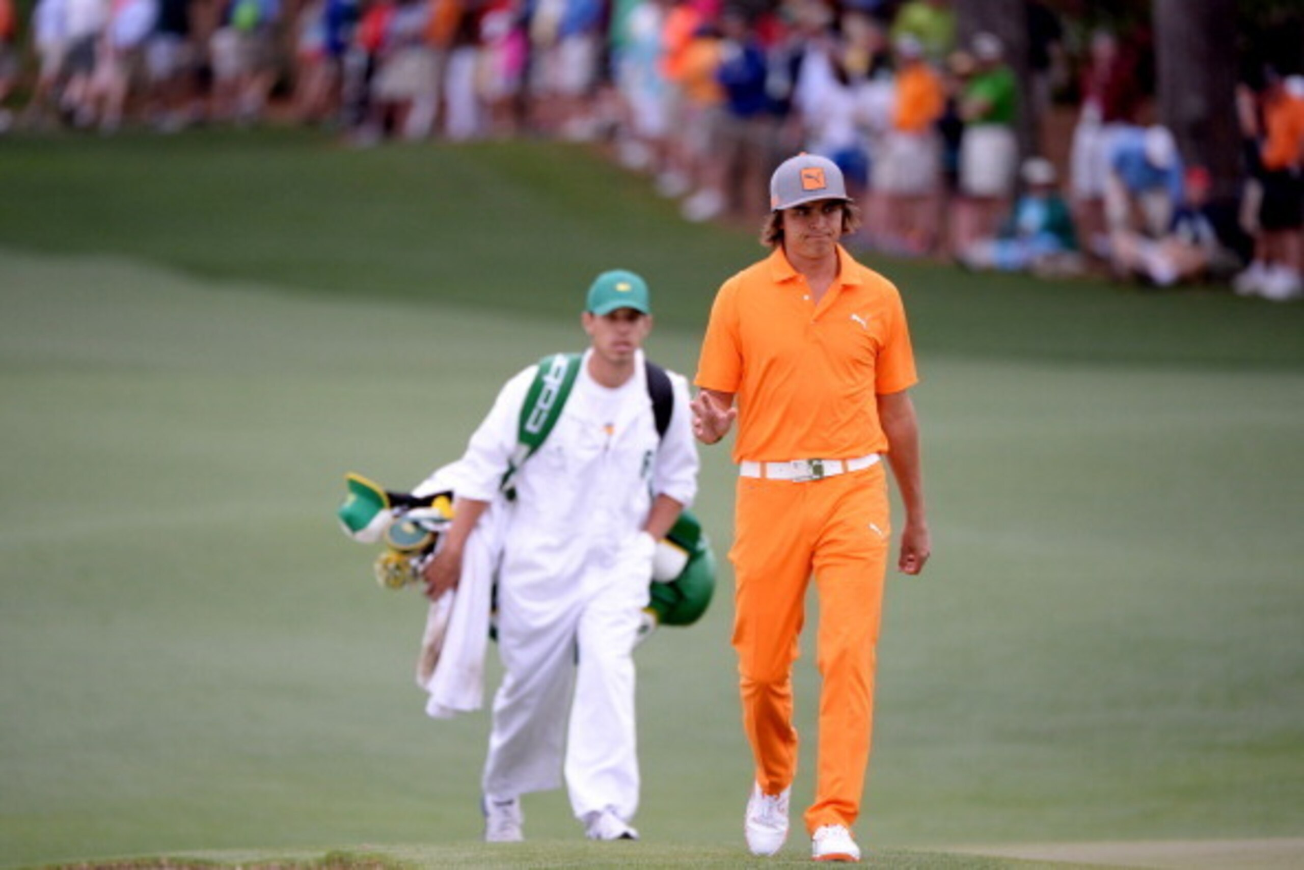 AUGUSTA, GA - APRIL 14:  Rickie Fowler of the United States walks up the second fairway during the final round of the 2013 Masters Tournament at Augusta National Golf Club on April 14, 2013 in Augusta, Georgia.  (Photo by Harry How/Getty Images)