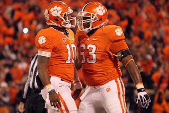CLEMSON, SC - NOVEMBER 24:  Tajh Boyd #10 of the Clemson Tigers celebrates after scoring a touchdown with teammate Brandon Thomas #63 during their game against the South Carolina Gamecocks at Memorial Stadium on November 24, 2012 in Clemson, South Carolin