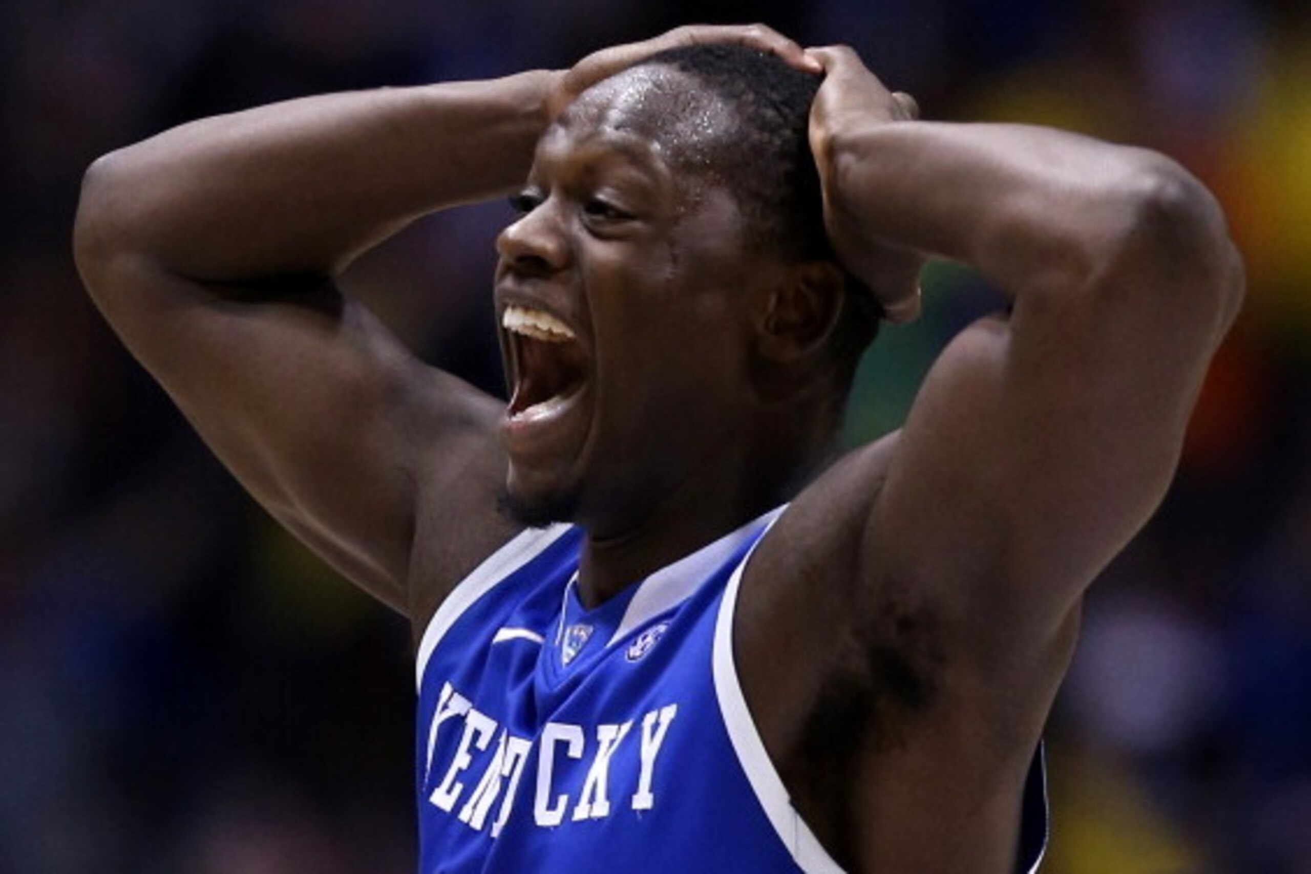 INDIANAPOLIS, IN - MARCH 30:  Julius Randle #30 of the Kentucky Wildcats celebrates after defeating the Michigan Wolverines 75 to 72 in the midwest regional final of the 2014 NCAA Men's Basketball Tournament at Lucas Oil Stadium on March 30, 2014 in India