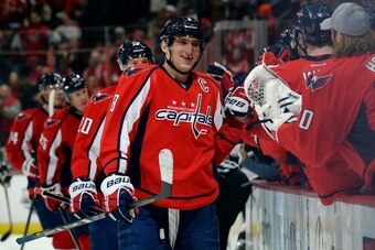 WASHINGTON, DC - MARCH 25:  Alex Ovechkin #8 of the Washington Capitals celebrates with his teammates after scoring a goal in the first period during an NHL game against the Los Angeles Kings at Verizon Center on March 25, 2014 in Washington, DC.  (Photo 