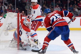 MONTREAL, QC - JANUARY 25: Braden Holtby #70 and Alex Ovechkin #8 of the Washington Capitals  defend the goal against Josh Gorges #26 of the Montreal Canadiens during the NHL game on January 25, 2014 at the Bell Centre in Montreal, Quebec, Canada. (Photo 