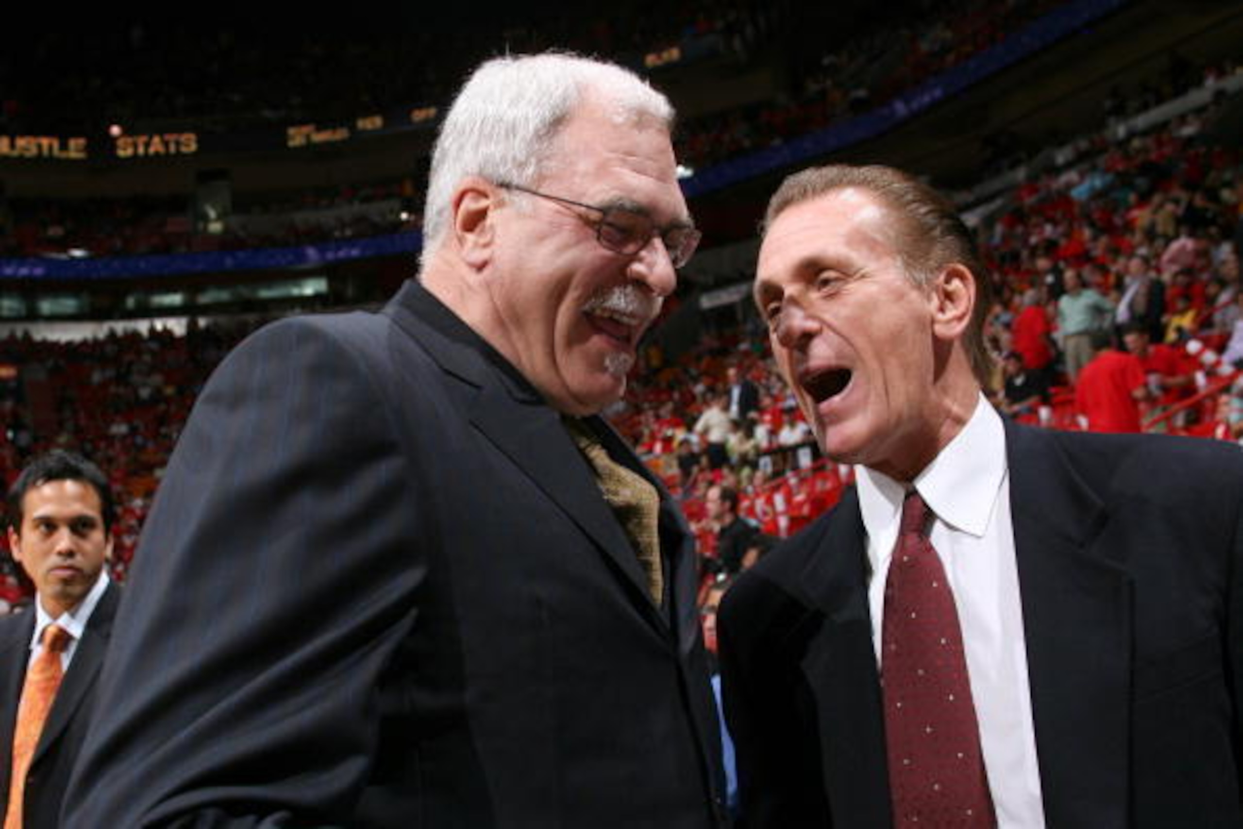 MIAMI - DECEMBER 25:  (L-R) Head Coach of the Los Angeles Lakers Phil Jackson and Head Coach of the Miami Heat Pat Riley share a laugh before the game on December 25, 2005 at American Airlines Arena in Miami, Florida. The Heat defeated the Lakers 97-92.  
