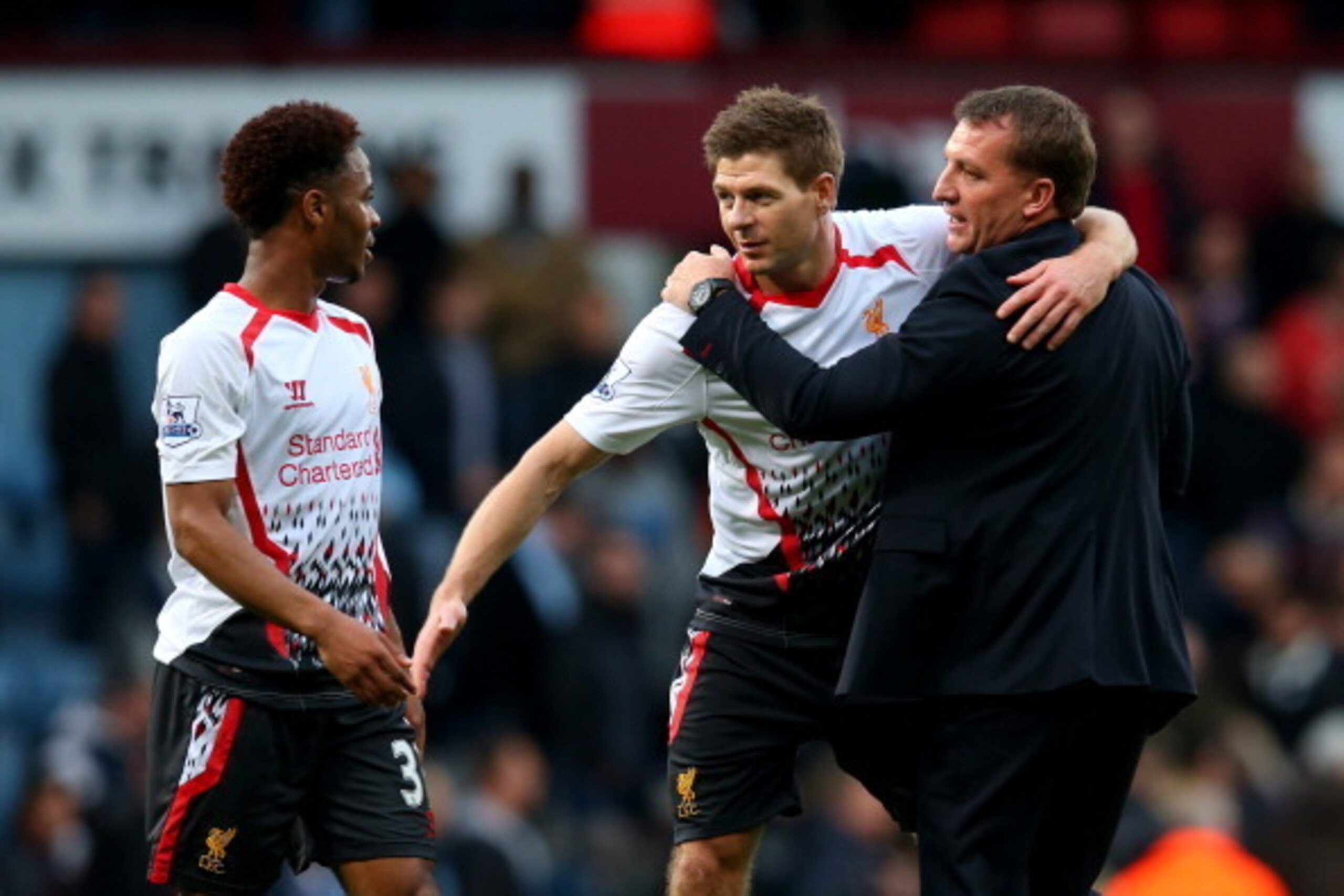 LONDON, ENGLAND - APRIL 06:  (L-R) Raheem Sterling, Steven Gerard and Brendan Rogers of Liverpool celebrate their team's 2-1 victory during the Barclays Premier League match between West Ham United and Liverpool at Boleyn Ground on April 6, 2014 in London