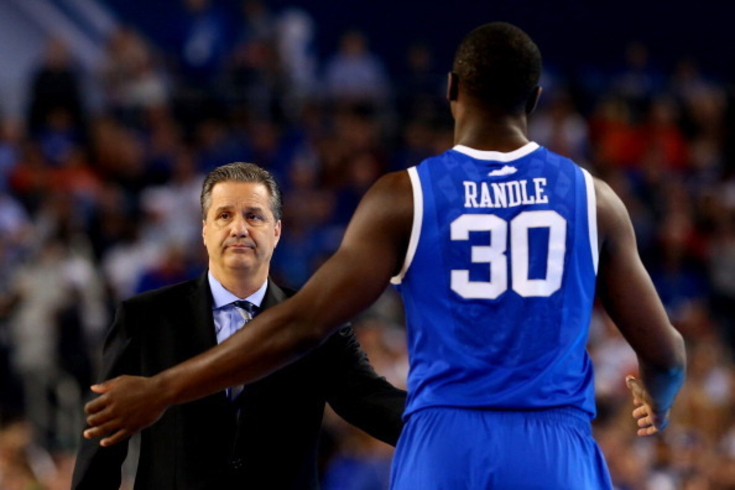 ARLINGTON, TX - APRIL 07: Head coach John Calipari reacts as Julius Randle #30 of the Kentucky Wildcats walks towards the bench during the NCAA Men's Final Four Championship against the Connecticut Huskies at AT&T Stadium on April 7, 2014 in Arlington, T ARLINGTON, TX - APRIL 07: Head coach John Calipari reacts as Julius Randle #30 of the Kentucky Wildcats walks towards the bench during the NCAA Men's Final Four Championship against the Connecticut Huskies at AT&T Stadium on April 7, 2014 in Arlington, T