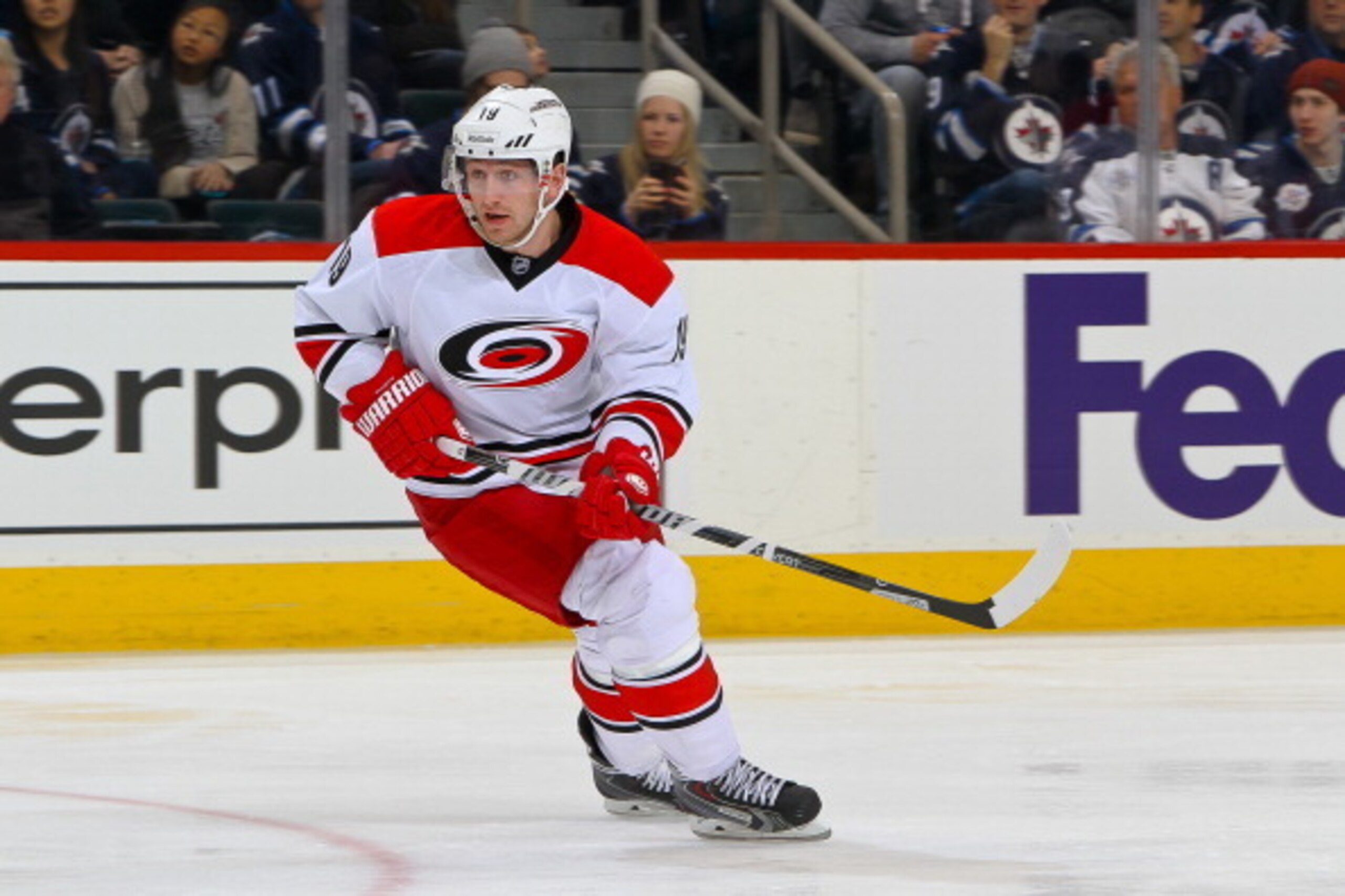 WINNIPEG, MB - MARCH 22: Jiri Tlusty #19 of the Carolina Hurricanes keeps an eye on the play during first period action against the Winnipeg Jets at the MTS Centre on March 22, 2014 in Winnipeg, Manitoba, Canada. The Canes defeated the Jets 3-2. (Photo by