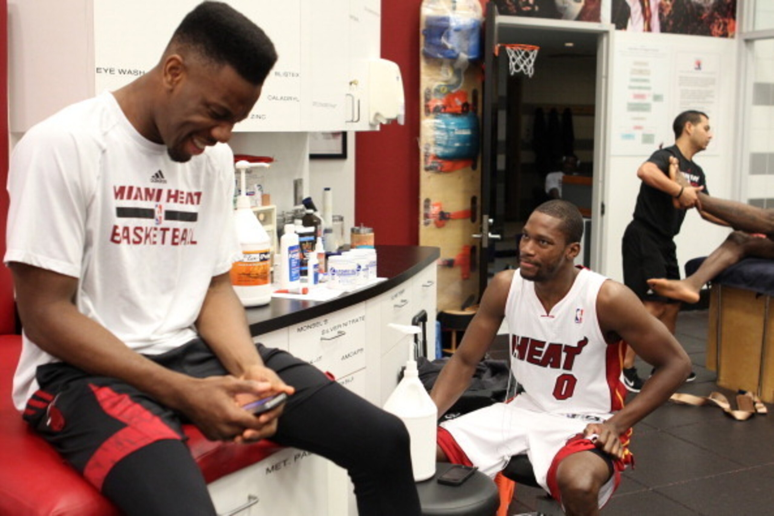 MIAMI, FL - APRIL 6: Norris Cole #30 and Toney Douglas #0 of the Miami Heat prepare before the game against the New York Knicks on April 6, 2014 at American Airlines Arena in Miami. NOTE TO USER: User expressly acknowledges and agrees that, by downloading