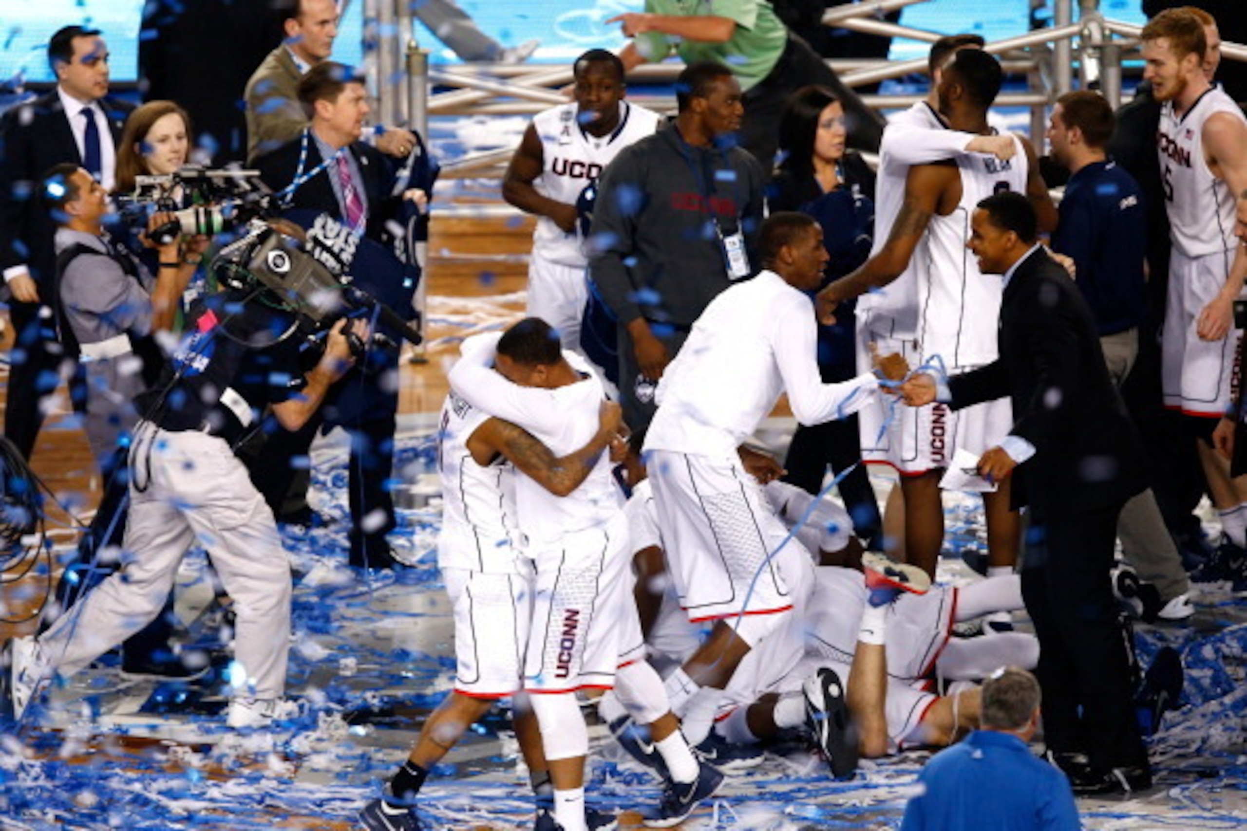 ARLINGTON, TX - APRIL 07: Shabazz Napier #13 and Ryan Boatright #11 of the Connecticut Huskies celebrate after defeating the Kentucky Wildcats 60-54 in the NCAA Men's Final Four Championship at AT&T Stadium on April 7, 2014 in Arlington, Texas.  (Photo by