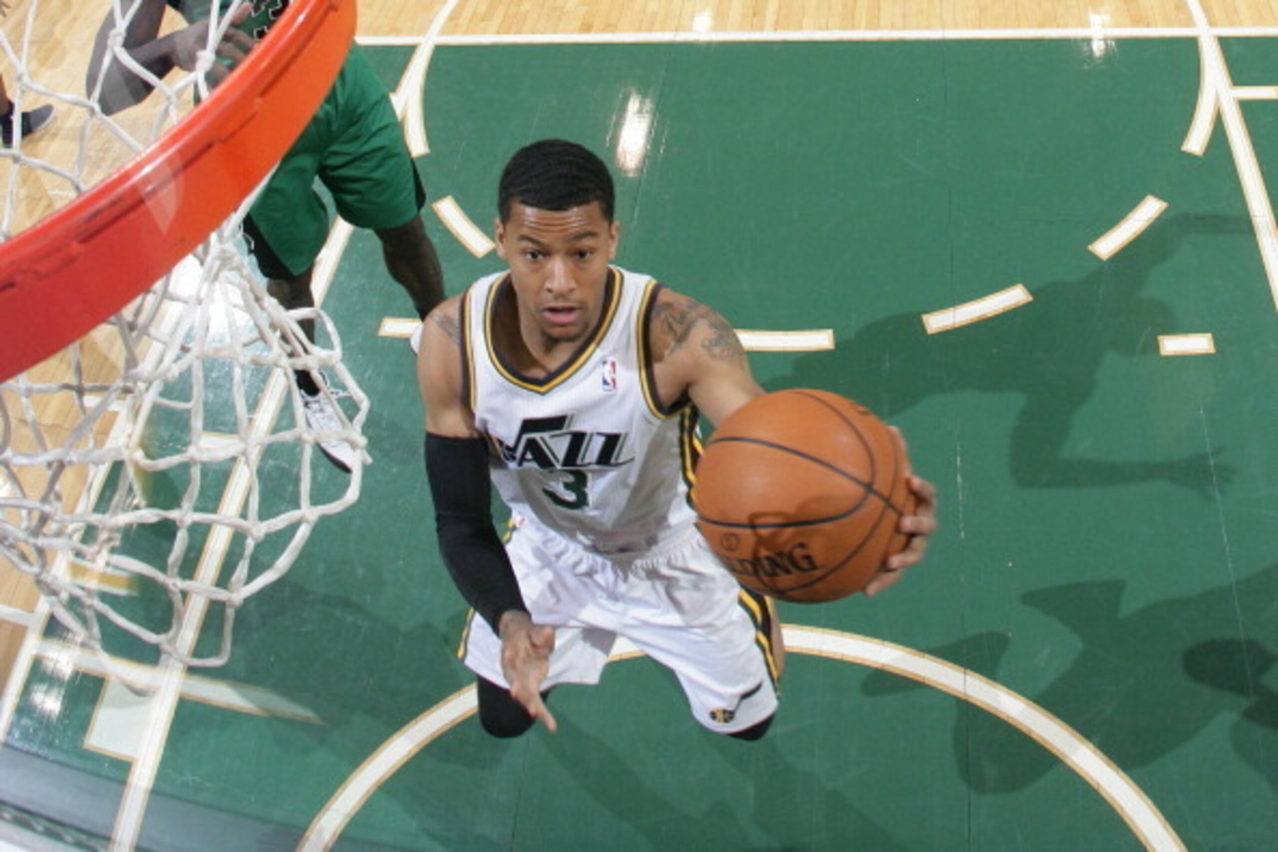 SALT LAKE CITY, UT - FEBRUARY 24:  Trey Burke #3 of the Utah Jazz shoots a layup against the Boston Celtics at EnergySolutions Arena on February 24, 2014 in Salt Lake City, Utah. NOTE TO USER: User expressly acknowledges and agrees that, by downloading an